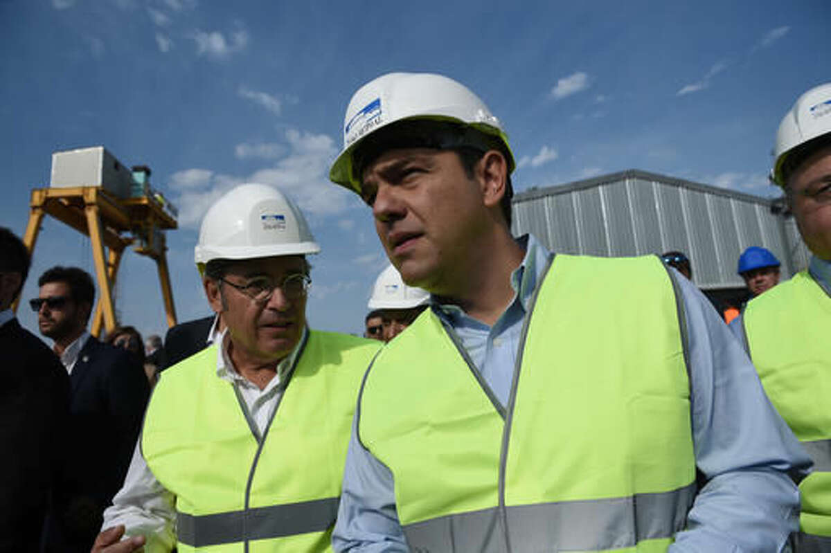 Greek Prime Minister Alexis Tsipras, center, visits a construction site of the Thessaloniki Metro project, at the northern Greek city of Thessaloniki, on Saturday, Sept. 10, 2016. Greece, which depends on a bailout cash before the end of October to stay afloat, has recently fallen short of reform commitments, stoking concerns of a flare-up in the country's debt crisis. (AP Photo/Giannis Papanikos)
