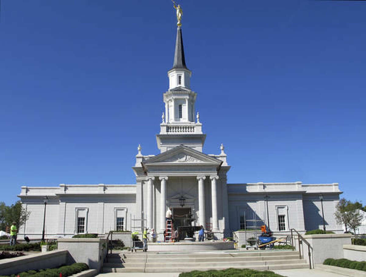 In this Sept. 22, 2016 photo, construction crews continue work on a Mormon temple in Farmington, Conn. The first Mormon temple in Connecticut opens to the public this week and will soon host services for thousands of the faithful from a four-state area. The new temple in Farmington reflects growing membership for the Church of Jesus Christ of Latter-day Saints on the East Coast. (AP Photo/Pat Eaton-Robb)