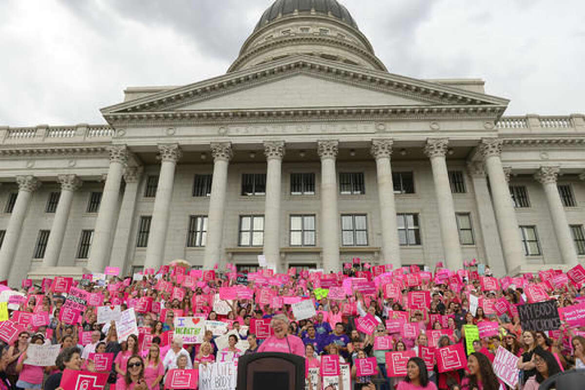 FILE - This Aug. 25, 2015, file photo, Karrie Galloway, CEO of Planned Parenthood Action Council, laughs as the roar of the crowd drowns out her speech at the state Capitol, in Salt Lake City. A judge is ordering the state of Utah not to stop funding its Planned Parenthood branch over advocacy for legal abortion or unproven allegations against the national organization. (Leah Hogsten/The Salt Lake Tribune via AP, File)
