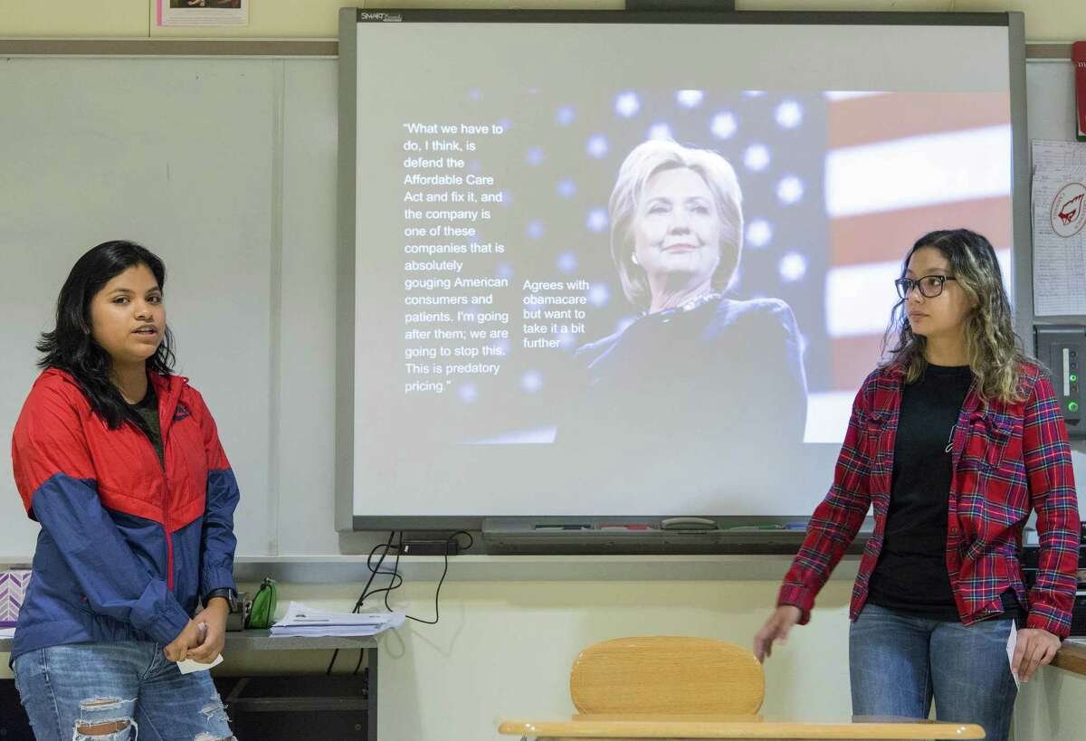 Students Gianella Guadalupe and Aryana Fernandes explain the Democratic side in a debate between the Democratic and Republican positions on Health Care in the United States in Karen Boyea's Honor Civics class at Greenwich High School, Greenwich, CT. Friday, October 14, 2016.