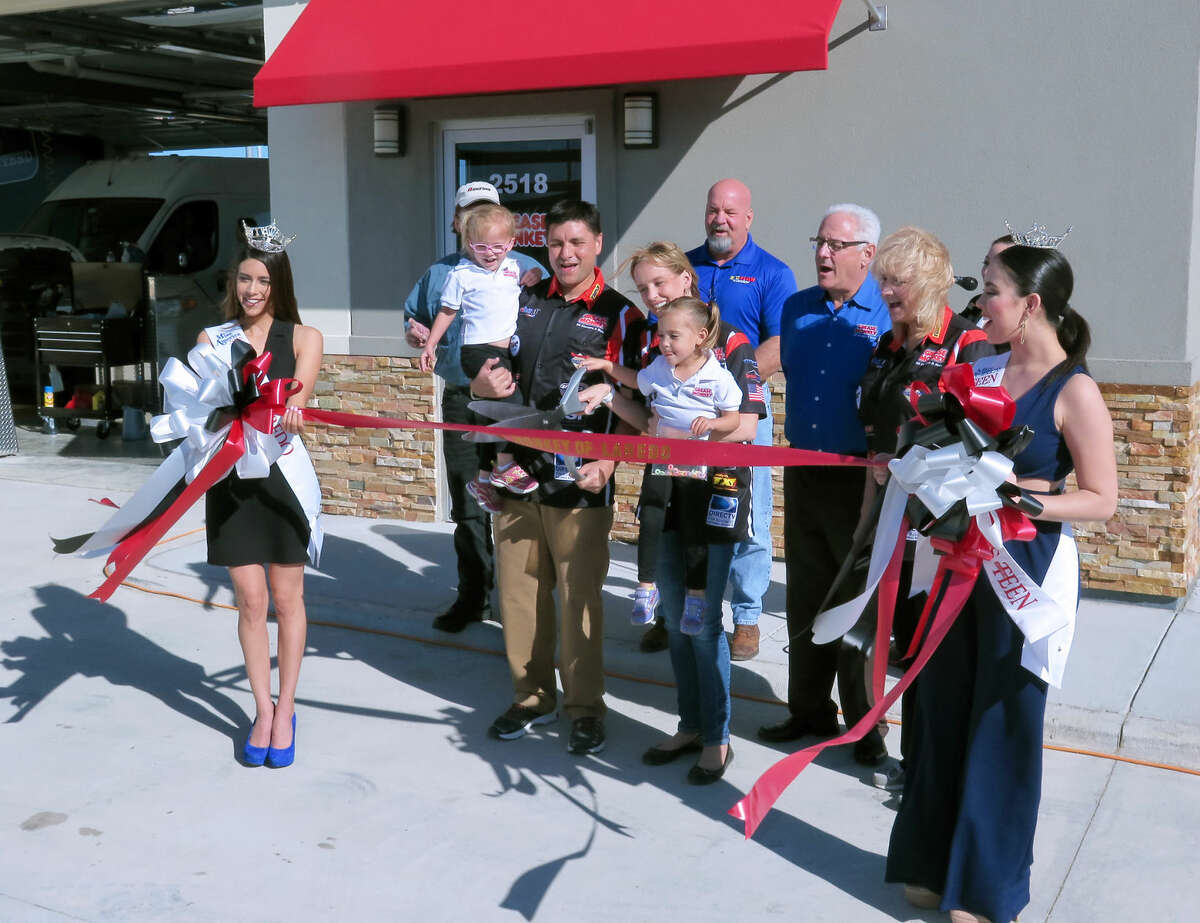 Owners Robert and Amy Rodriguez and their daughters cut the ribbon for Grease Monkey of Laredo Friday morning. The business is located at 2518 Bob Bullock Loop, west of International Boulevard.