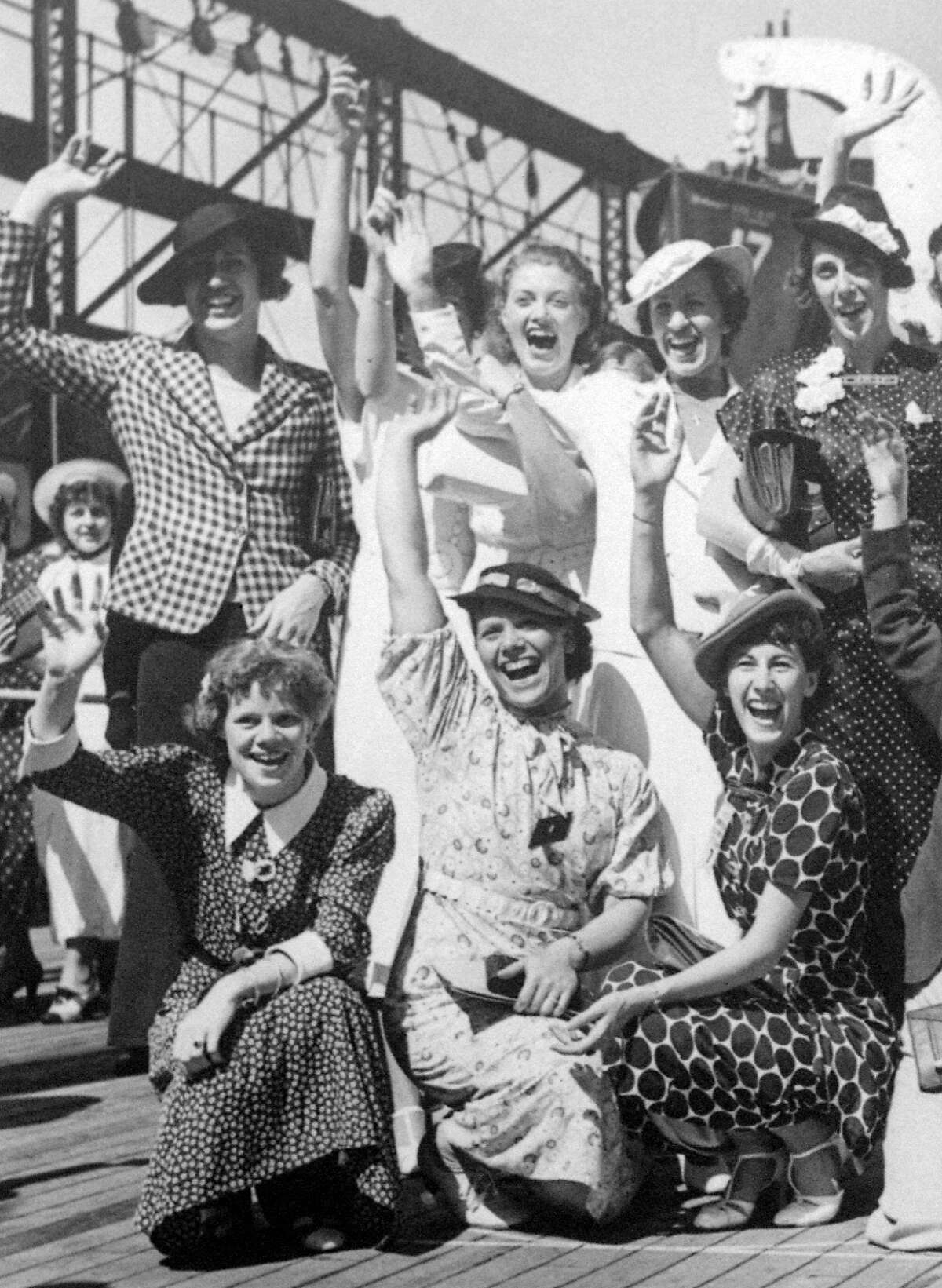 In this July 15, 1936, file photo, Simone Schaller, lower right, waves with members of the United States women's Olympic track and field team as they depart for Europe on the SS Manhattan. Schaller, an American hurdler who competed at the 1932 and 1936 Summer Games and was believed to be the oldest living Olympian, died of natural causes Thursday, Oct. 20, 2016, in the Arcadia, Calif., home she and her husband built when they married in the 1930s, her grandson Jeffrey Hardy said, Saturday, Oct. 22, 2016. She was 104. (AP Photo/File)
