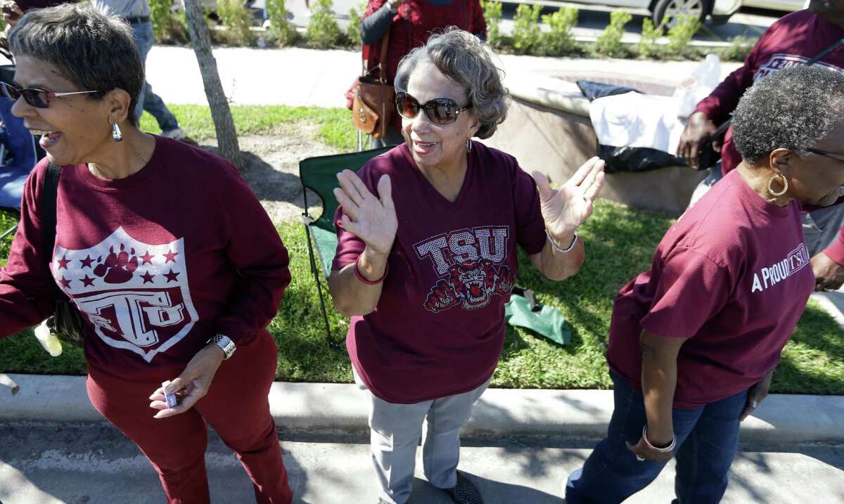 Alma Henley, center, a member of Texas Southern University class of 1961, watches the TSU homecoming parade Saturday, Oct. 22, 2016, in Houston.