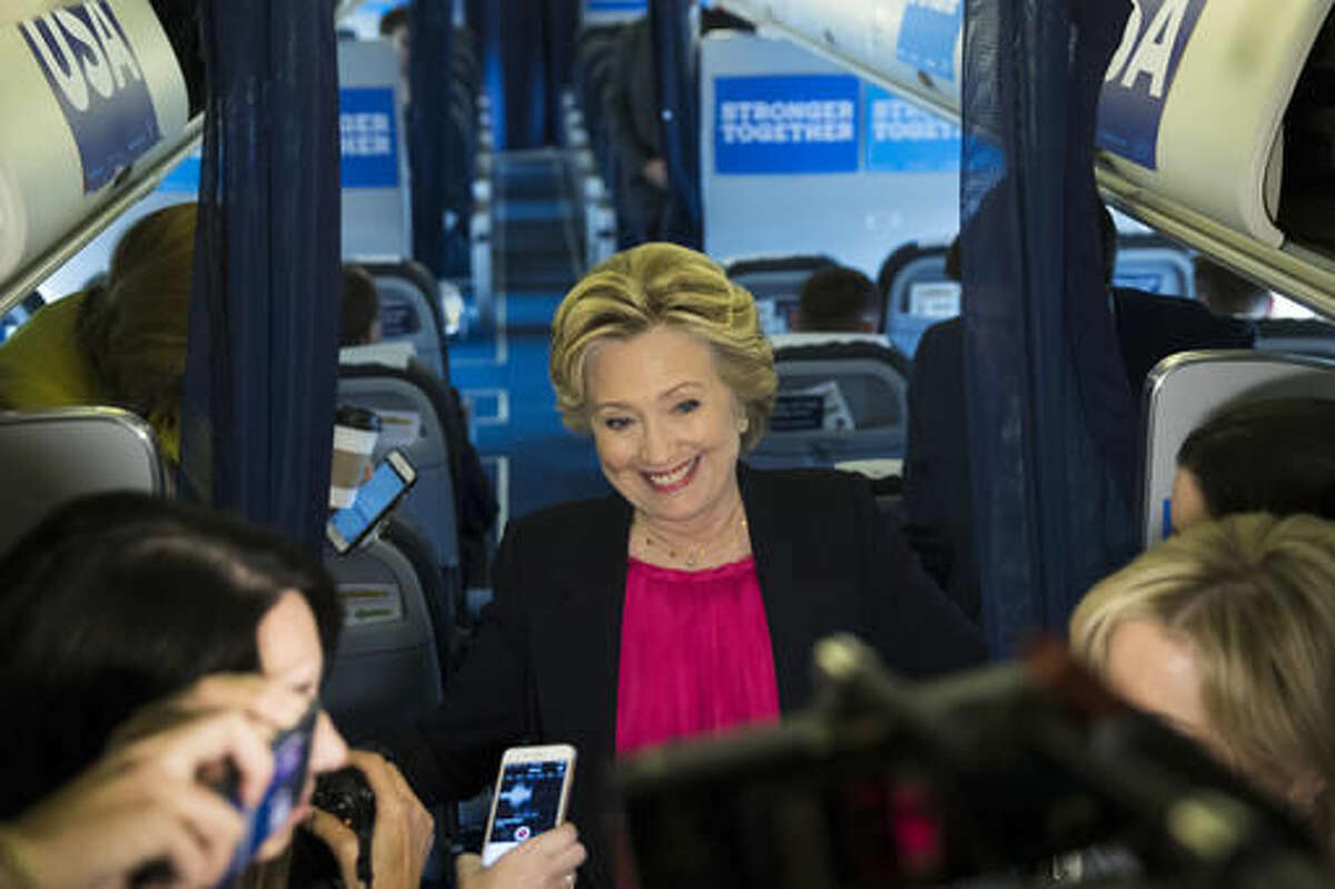 Democratic presidential candidate Hillary Clinton speaks with members of the media on board her campaign plane at Westchester County Airport in White Plains, N.Y., Tuesday, Sept. 27, 2016. (AP Photo/Matt Rourke)