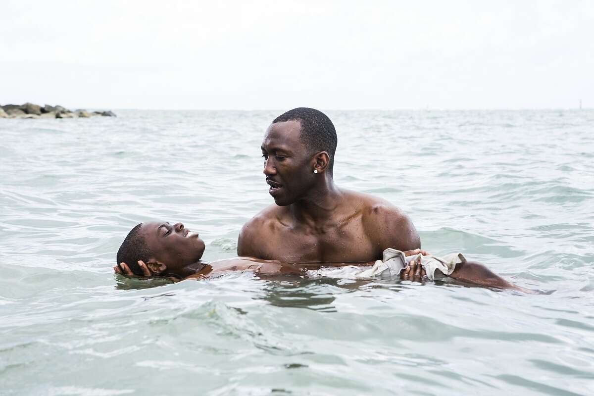 This image released by A24 Films shows Alex Hibbert, left, and Mahershala Ali in a scene from the film, "Moonlight." (David Bornfriend/A24 via AP)