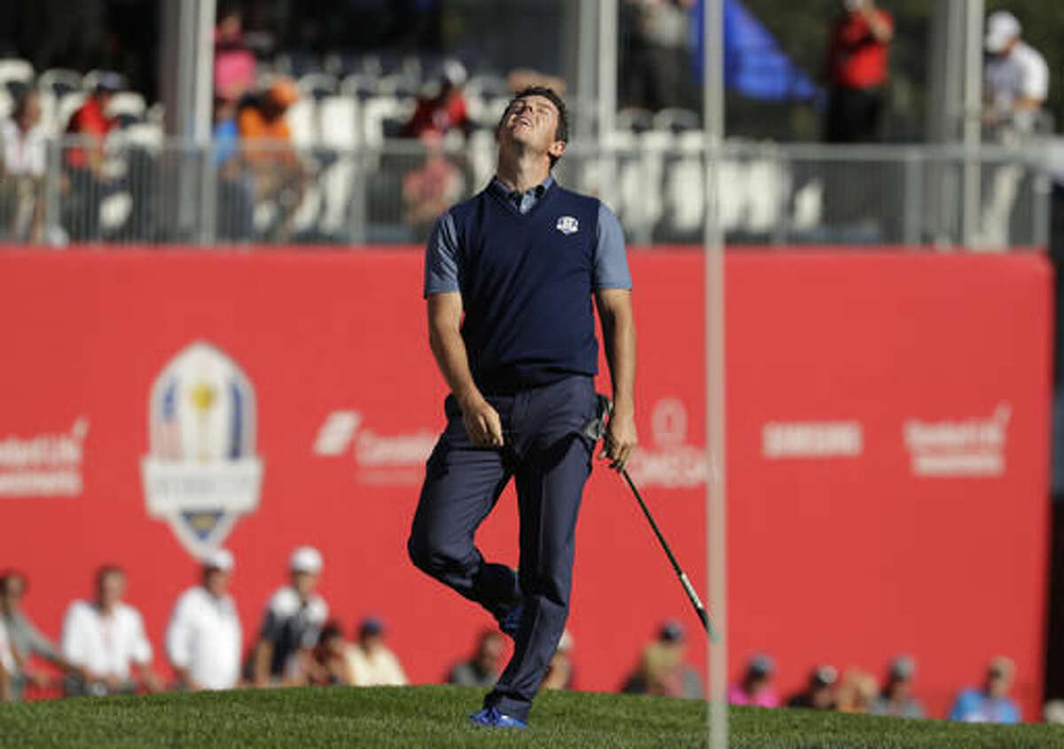 Europe’s Rory McIlroy reacts to a shot on the ninth hole during a four-balls match at the Ryder Cup golf tournament Friday, Sept. 30, 2016, at Hazeltine National Golf Club in Chaska, Minn. (AP Photo/Charlie Riedel)