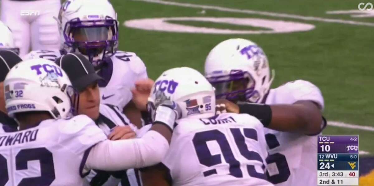 During a Saturday football game between Texas Christian University and West Virginia, TCU defensive lineman Aaron Curry choked on his chinstrap after a third-quarter pile up.  (ESPN/ABC) Click through to see other notable Houston sports injuries. 