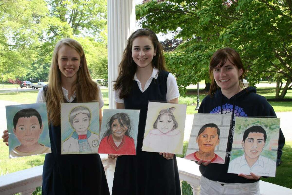 Lauralton Hall Art Club students, from left, Teresa Starzecki, '11, of Shelton, Chloe Walker, '11, of Fairfield, and Emma Molloy, '10, of New Canaan, pose with the portraits they created of orphaned children in Peru as part of a nationwide program called The Memory Project.