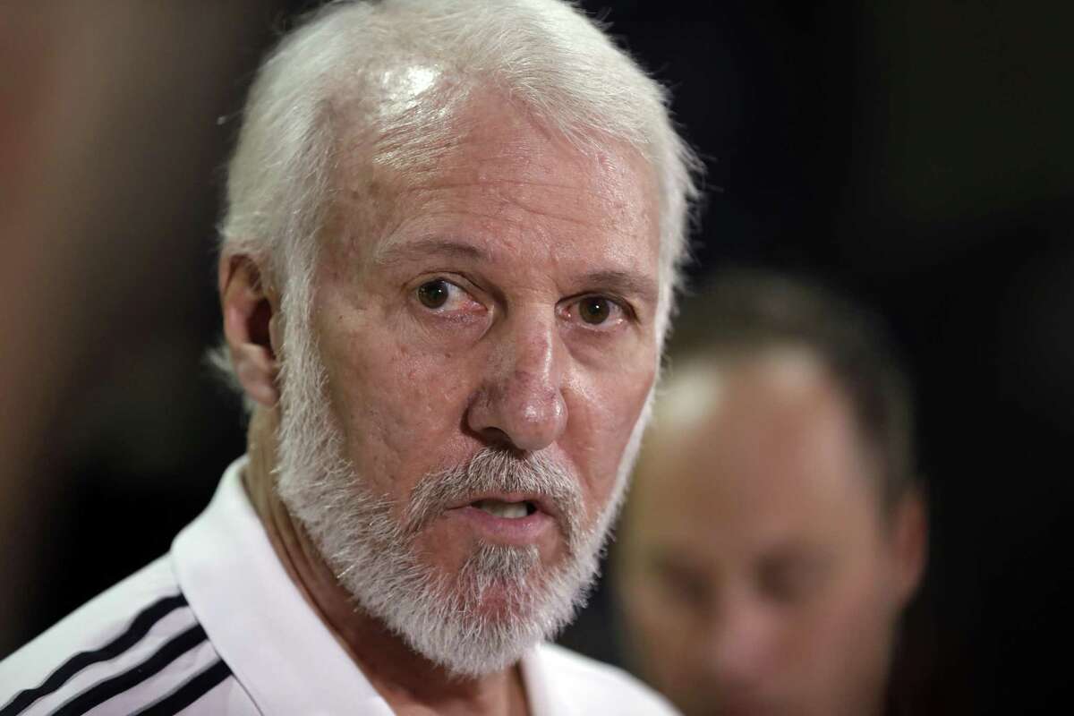 Popovich, speaking during the Spurs’ media day (above), is in the strange position of entering a season without Tim Duncan.