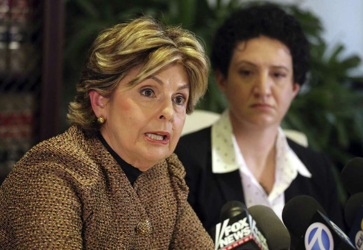 Ann Russo, right, who describes herself as a friend of Donald Trump accuser Summer Zervos, and attorney Gloria Allred discuss Russo's experience with Zervos and the claims against Trump, at a news conference in Los Angeles Sunday, Oct. 16, 2016. Russo said that Zervos told her in about 2010 that Trump had been verbally, physically and sexually aggressive with her during a job interview at that time. (AP Photo/Reed Saxon)