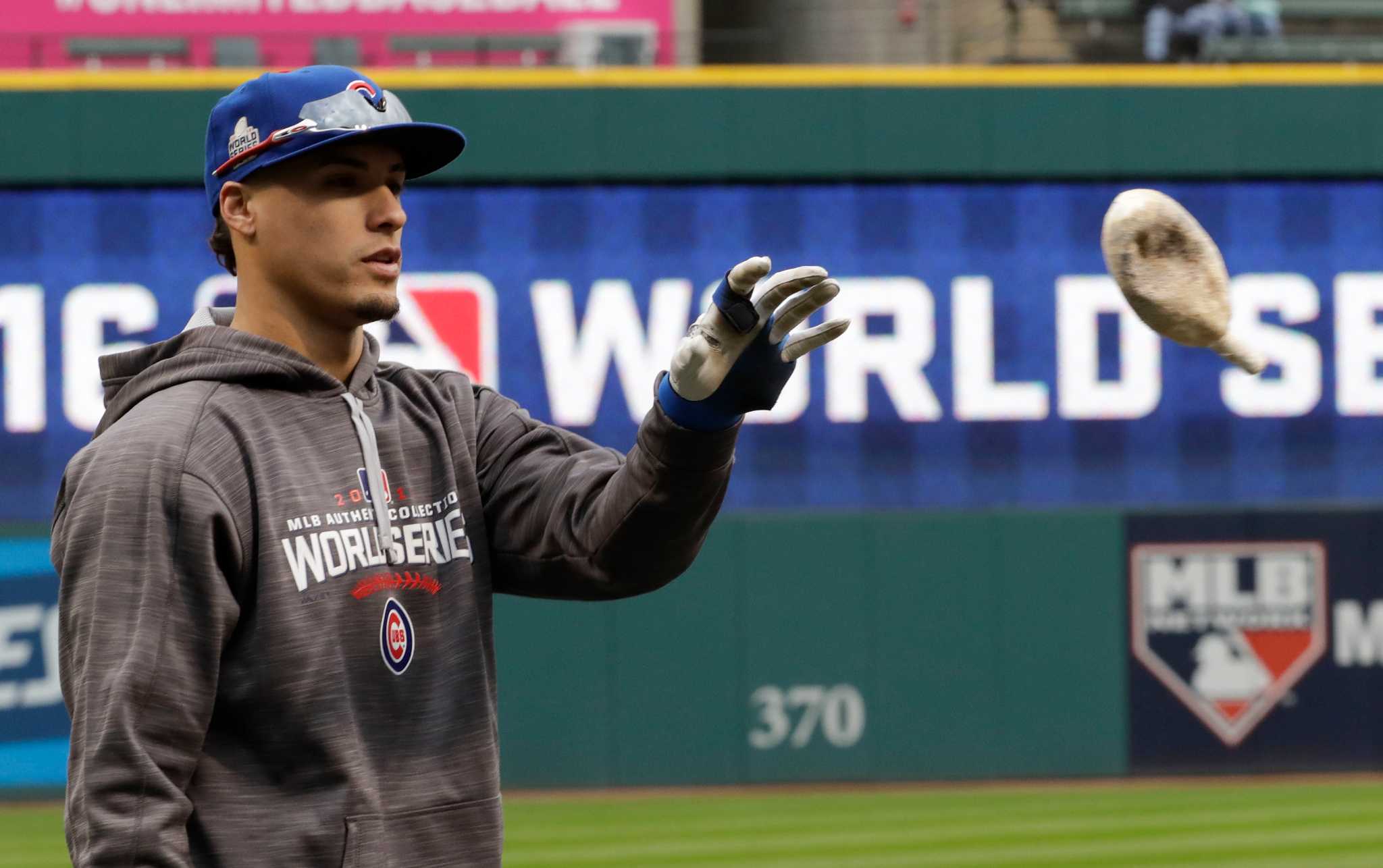 Chicago Cubs first baseman Anthony Rizzo, left, receives a Championship Ring  during a ring ceremony before a baseball game between the Chicago Cubs and  Los Angeles Dodgers at Wrigley Field on April