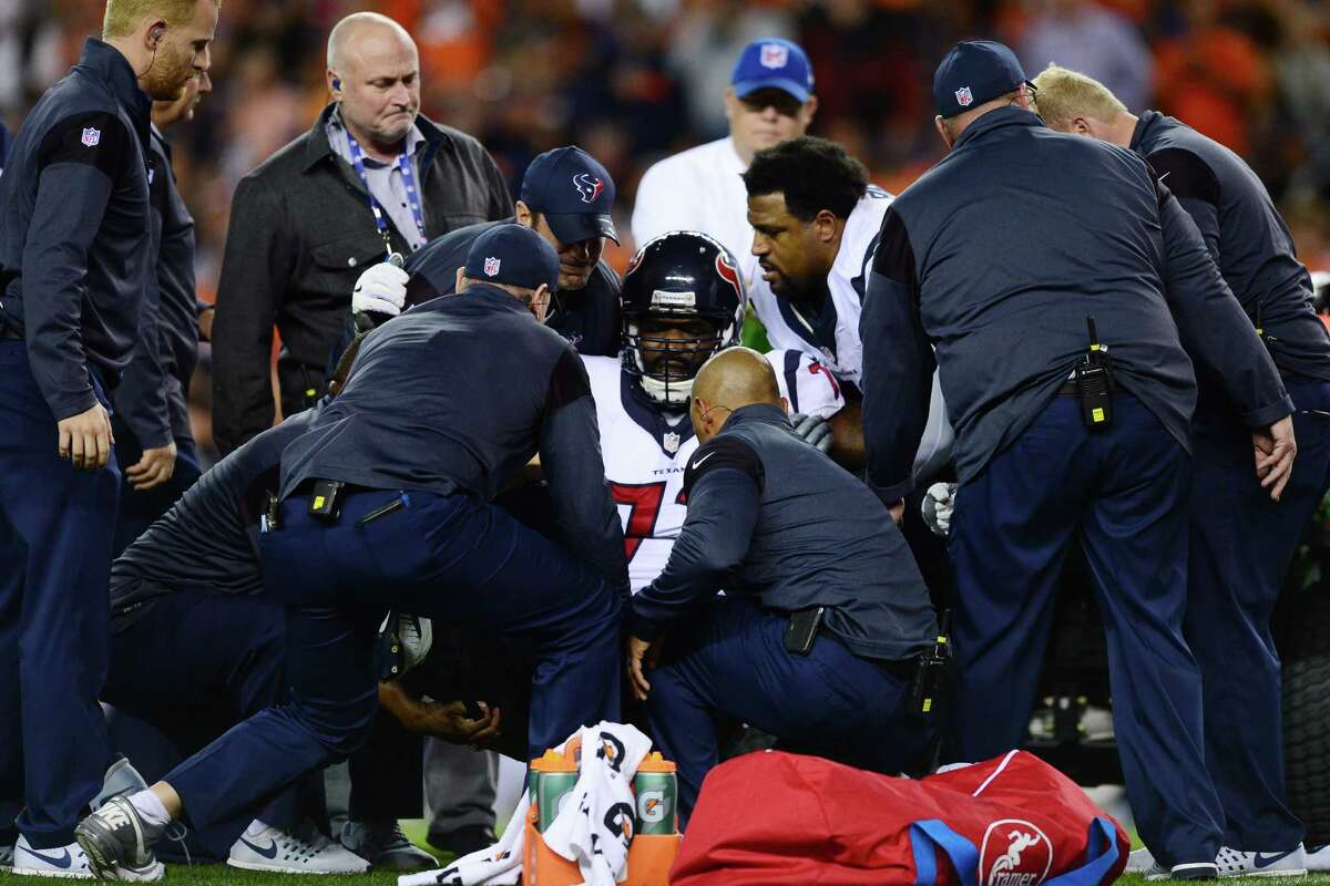 DENVER, CO - OCTOBER 24: Tackle Derek Newton #72 of the Houston Texans is carted off the field in the first quarter of the game against the Denver Broncos at Sports Authority Field at Mile High on October 24, 2016 in Denver, Colorado.