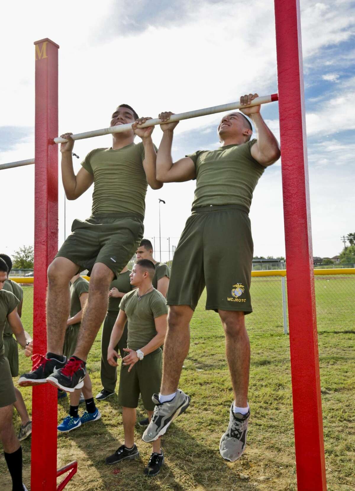 United South High School Marine Corp JROTC members Aaron Sanchez and Luis Gutierrez perform a set of pull-up exercises, Monday morning, at the newly installed pull-up bars at Independence Hills Regional Park. The equipment was donated by Laredo Law Enforcement Marines as they celebrated the 239th Marine Corp founding anniversary. (Photo by Victor Strife/LMT)