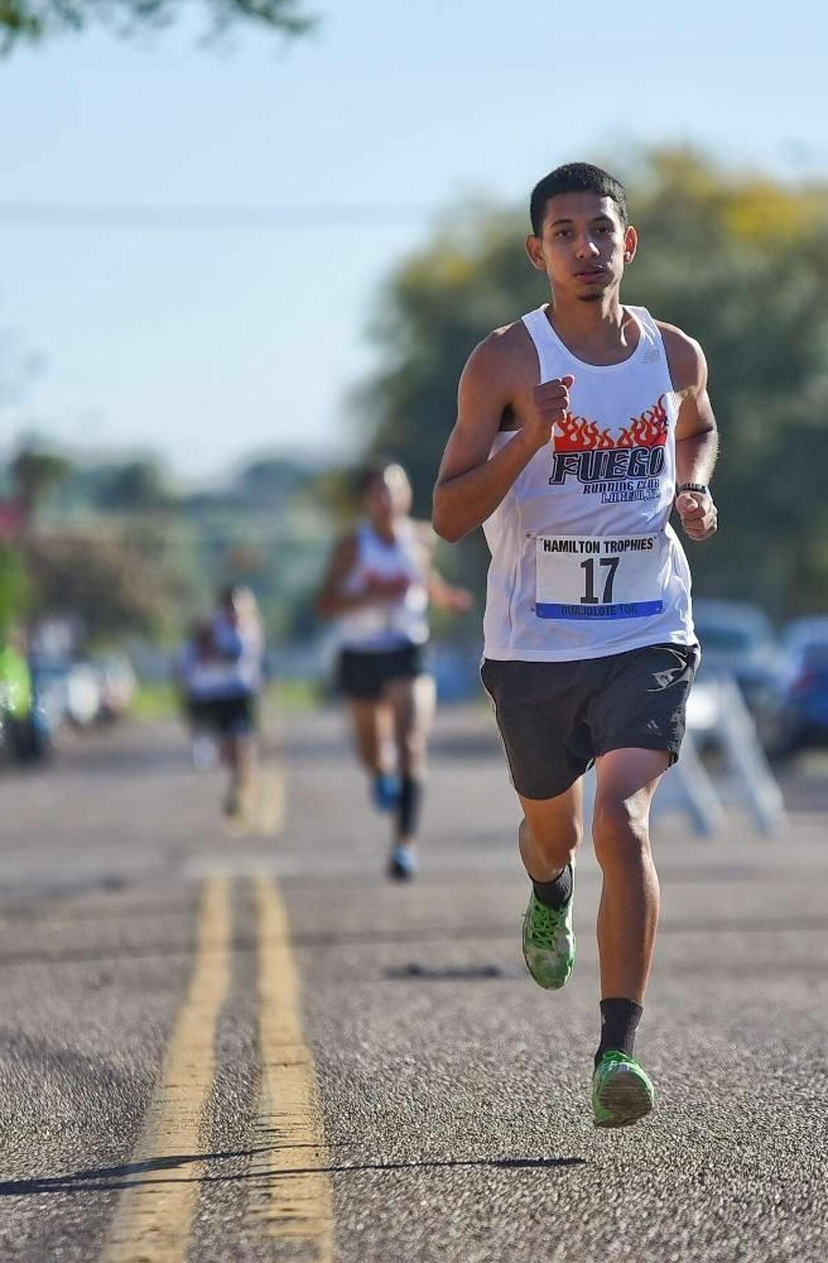 Angel Perez leads other runners down Garden Street on Thursday morning during the 35th Annual Guajolote 10k Race, sponosored by Hamilton Trophies. Perez won third place in this race. Photo by Danny Zaragoza