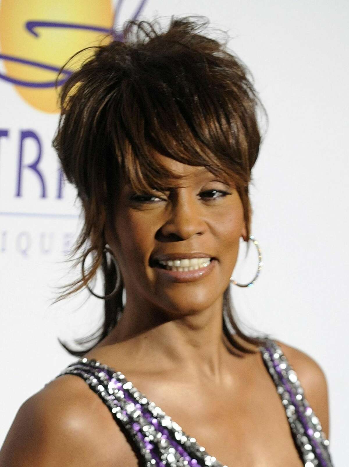 In this Feb. 9 file photo, singer Whitney Houston arrives at the Clive Davis pre-Grammy party in Beverly Hills, Calif.