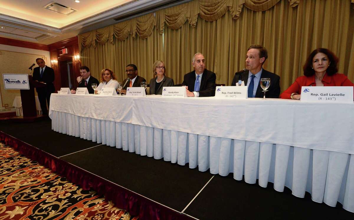 State REpresentative Fred Wilms (R-142), second from right, speaks as The Greater Norwalk Chamber of Commerce hosts a State Representatives Forum with Repsresentatives Gail Lavielle, Bruce V. Morris, Christopher R. Perone, Terrie E. Wood and candidates Randy Klein and Darline Perpignan. Tuesday, October 25, at The Norwalk Inn & Conference Center in Norwalk, Conn.