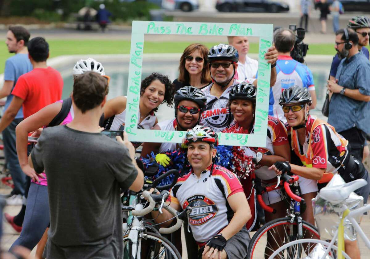 Cyclists pose in front of City Hall during a rally held to support Houston's bike plan on Oct. 25.