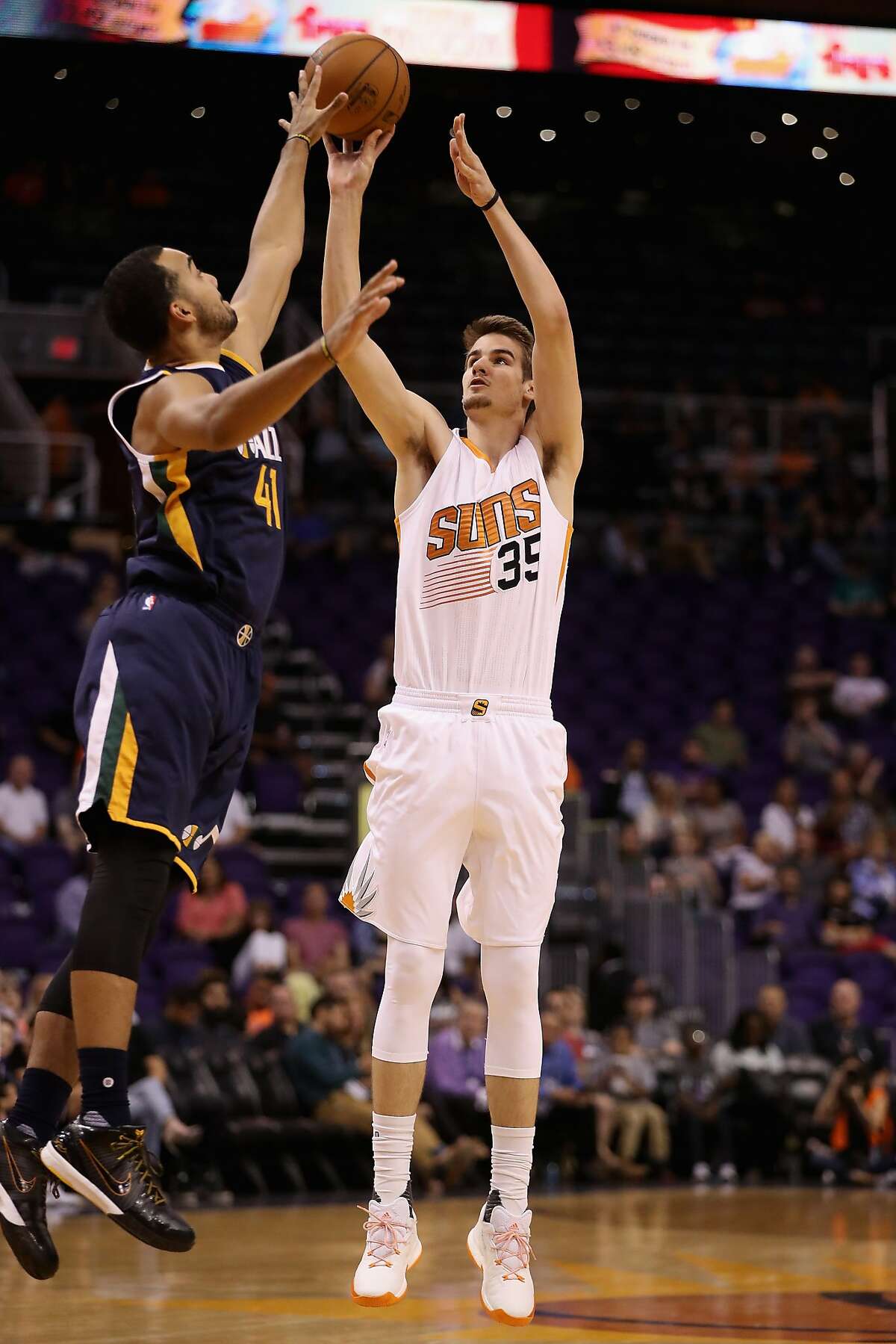 PHOENIX, AZ - OCTOBER 05: Dragan Bender #35 of the Phoenix Suns attempts a shot over Trey Lyles #41 of the Utah Jazz during the first half of the preseason NBA game at Talking Stick Resort Arena on October 5, 2016 in Phoenix, Arizona. NOTE TO USER: User expressly acknowledges and agrees that, by downloading and or using this photograph, User is consenting to the terms and conditions of the Getty Images License Agreement. (Photo by Christian Petersen/Getty Images)