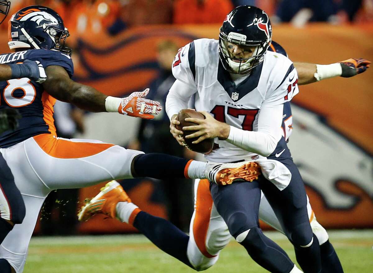 Houston Texans quarterback Brock Osweiler (17) is chased out of the pocket by Denver Broncos outside linebacker Von Miller (58) and defensive end Derek Wolfe (95) during the second quarter of an NFL football game at Sports Authority Field at Mile High on Monday, Oct. 24, 2016, in Denver. ( Brett Coomer / Houston Chronicle )