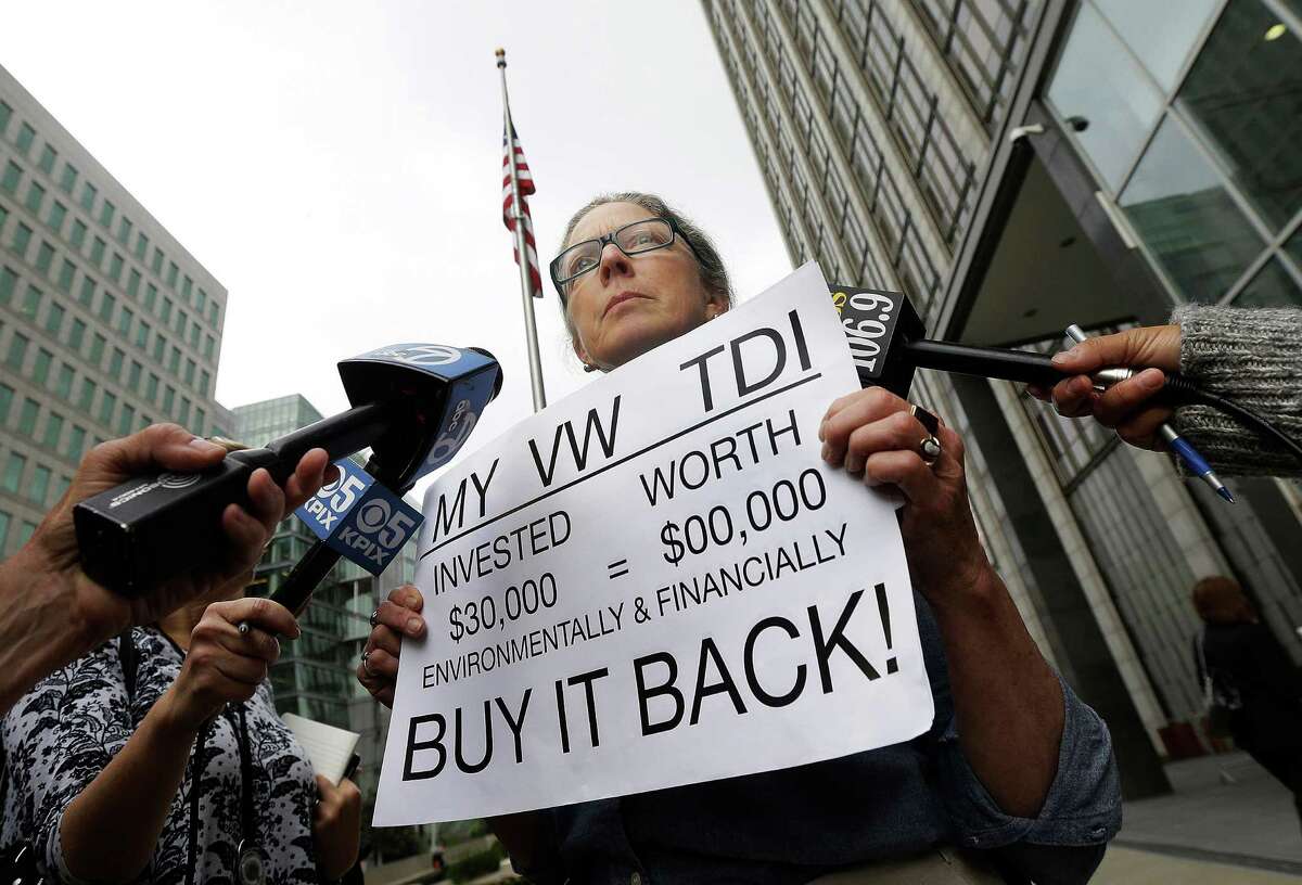 Joyce Ertel Hulbert, owner of a 2015 Volkswagen Golf TDI, protests while being interviewed in April outside a San Francisco courthouse.﻿﻿