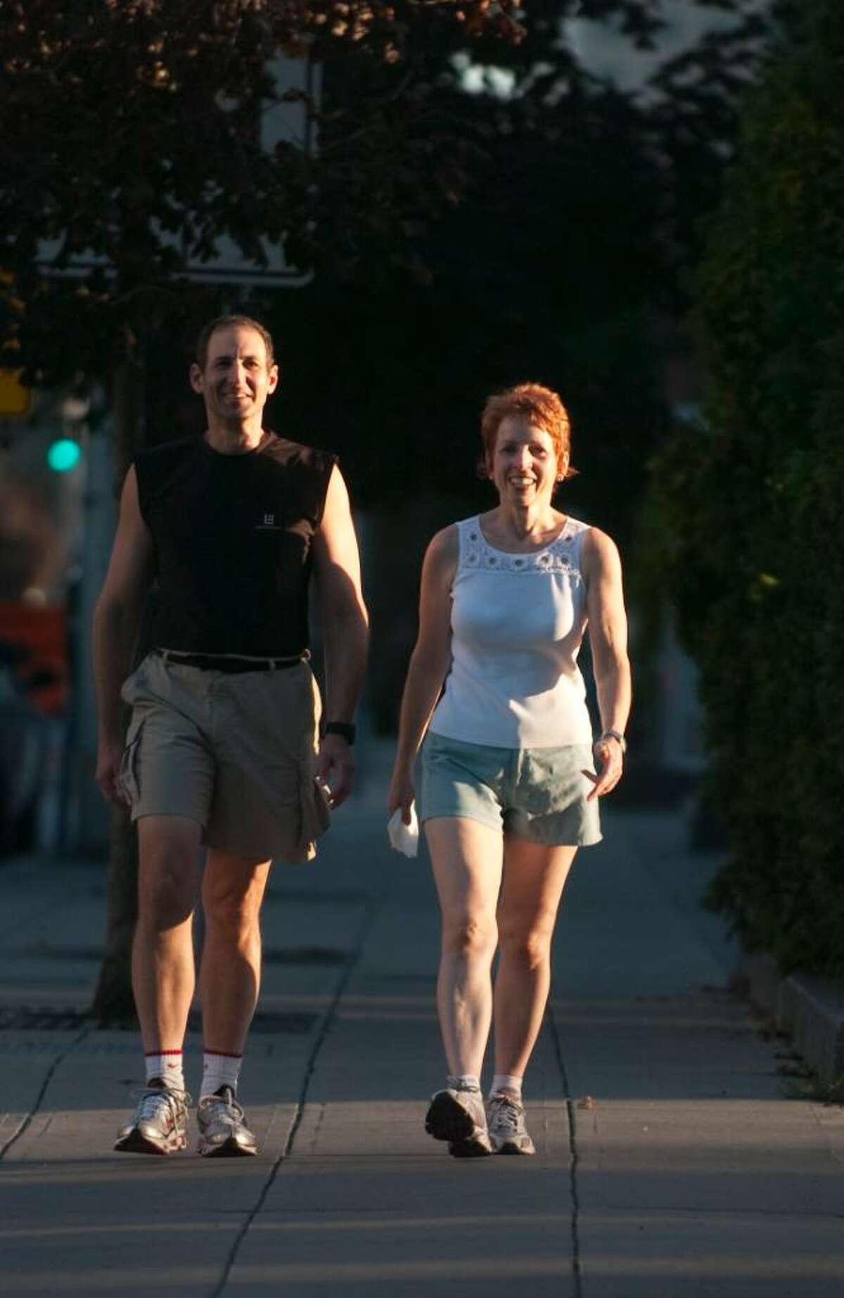 Myles Cohen, 58, and his wife Mary, 55, walk their usual route in downtown Stamford on Tuesday, September 1, 2009.