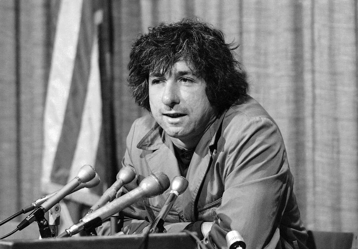 FILE - In this Dec. 6, 1973 file photo, political activist Tom Hayden, husband of Jane Fonda, tells newsmen in Los Angeles that he believes public support was partially responsible for the decision not to send him and others of the Chicago 7 to jail for contempt. Hayden, the famed 1960s anti-war activist who moved beyond his notoriety as a Chicago 8 defendant to become a California legislator, author and lecturer, has died at age 76. His wife, Barbara Williams, says Hayden died on Sunday, Oct. 23, 2016, in Santa Monica of a long illness. (AP Photo/George Brich, File)