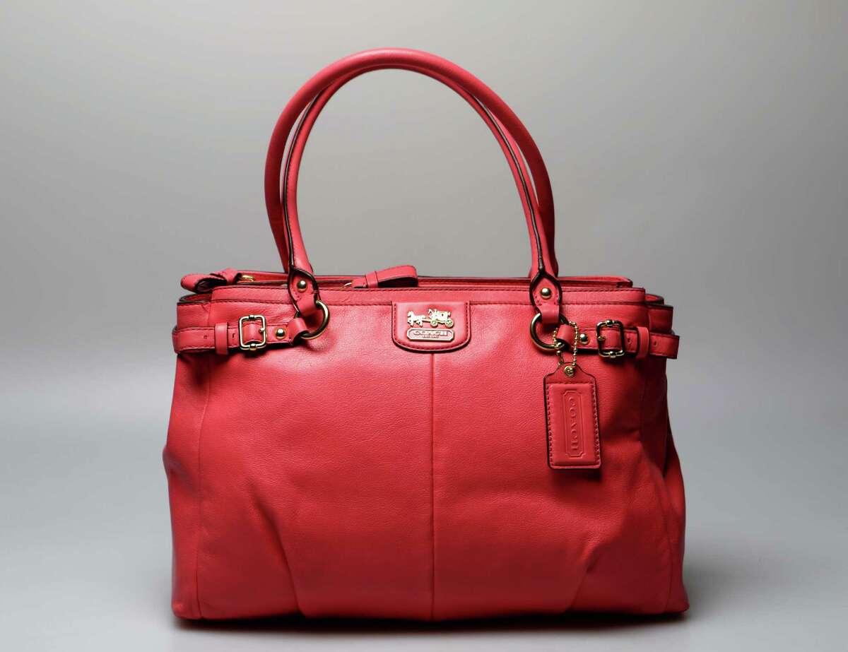 Salmon-hued leather handbag by Coach