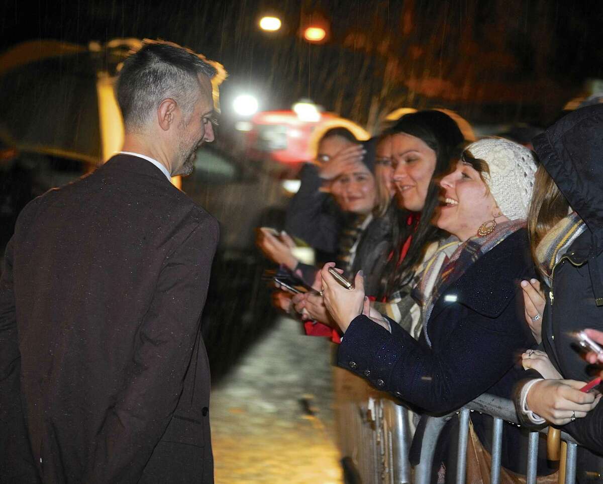 "Gilmore Girls" tv show cast member Sean Gunn, who plays "Kirk", talks with fans as he arrives at Bryan Memorial Town Hall for a cast pannel discussion during the Gilmore Girls Fan Fest in Washington Depot, Conn, on Saturday, October 22, 2016.