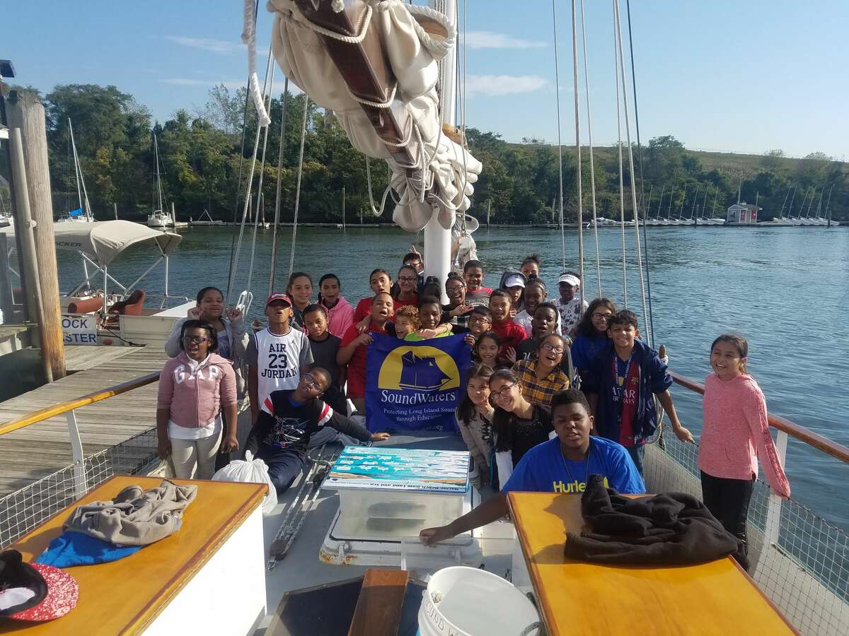 Students in Meghan Esteva’s 6th grade science class at Bridgeport’s Beardsley School prepare to embark on an educational sail on the schooner, SoundWaters, from Captain’s Cove Marina.