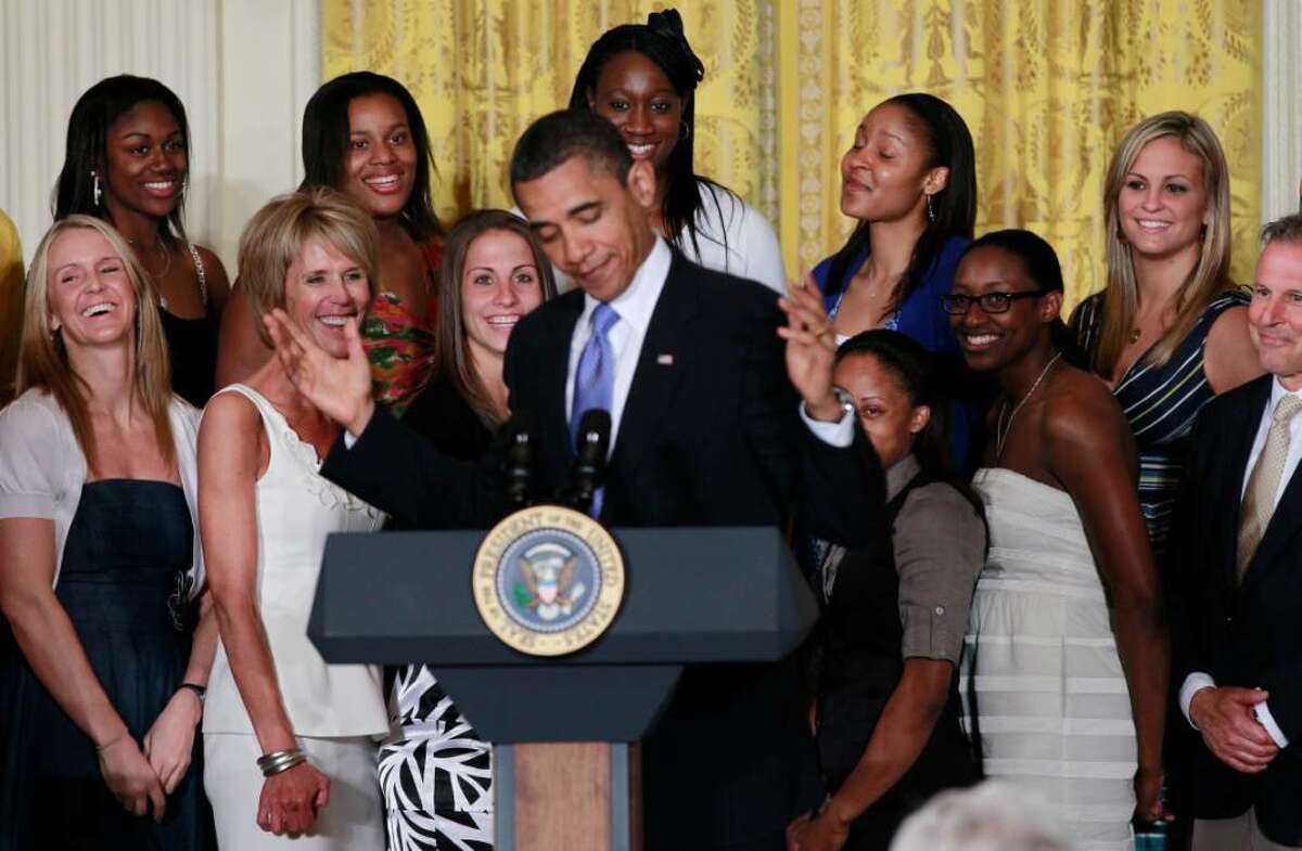 The 2010 NCAA champion University of Connecticut women's basketball team reacts as they are honored by President Barack Obama in the East Room of the White House in Washington, Monday, May 17, 2010. Pictured rear center are Tina Charles and Maya Moore, second right. (AP Photo/Charles Dharapak)