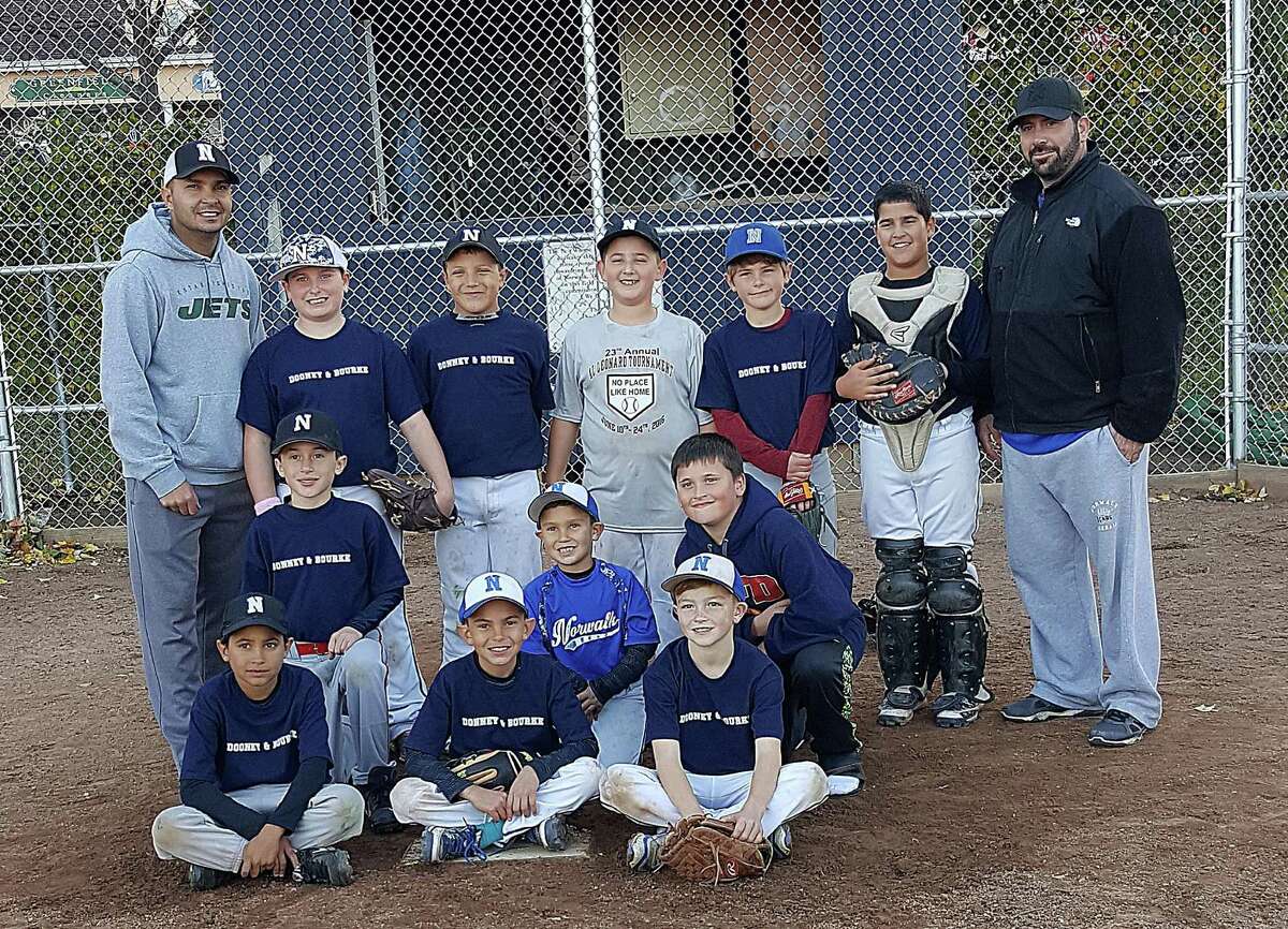 Dooney and Burke won the 2016 Norwalk Rec and Parks Fall Baseball 8-9 year old championship last weekend. Team members include, front row, from left, Marcus Villafane, Jayden Roman, and Matthew Weiss, middle row, from left, Justin Rich, Peyton Roman (Bat Boy), and Shane Stone, and back row, from left, Coach Andres Roman, Michael Marini, Dominic Muro, Ben Krammerer, Xavier Gonzales, and Coach Brian Muro.