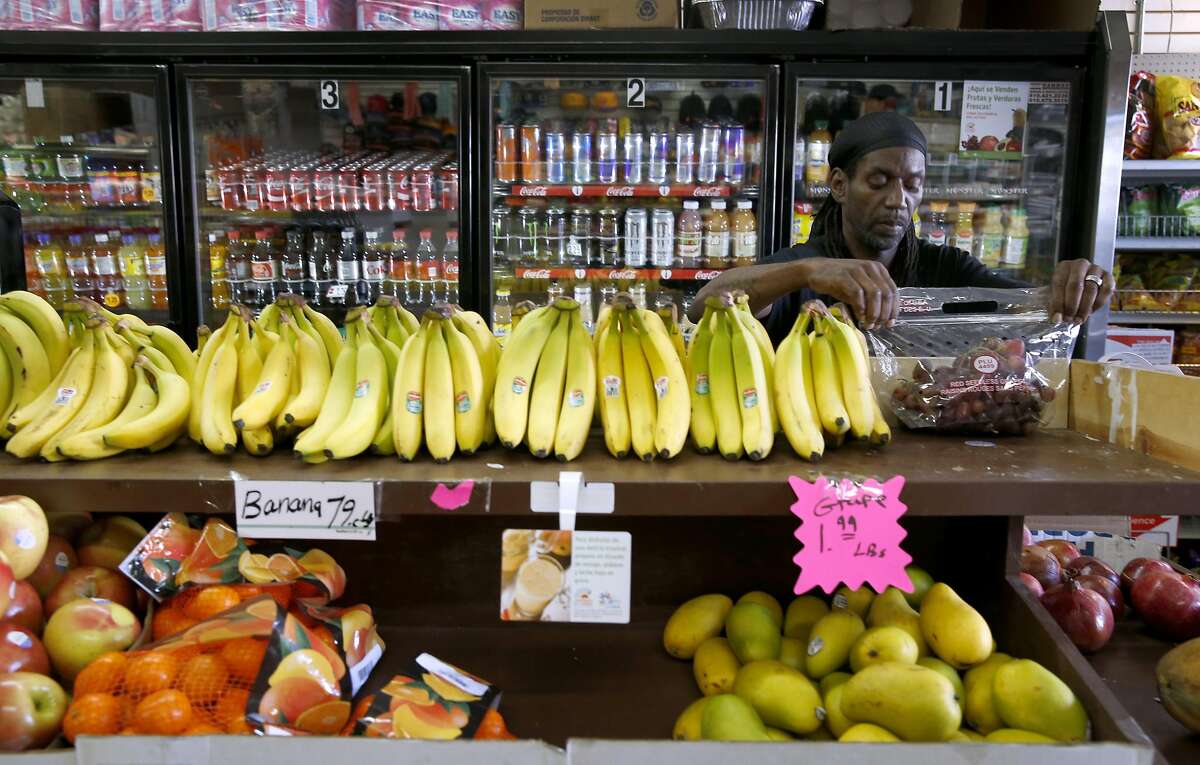 Kenneth Robinson restocks the fresh produce shelf at Palou Market on Third Street in San Francisco, Calif. on Wednesday, Oct. 26, 2016. Palou Market is one of the first corner stores to participate in the Healthy Retail SF program, which offers incentives to sell produce and other healthy food alternatives.