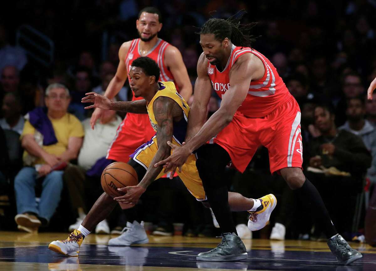 The Los Angeles Lakers' Lou Williams steals the ball from the Houston Rockets' Nene, right, in the first half at Staples Center in Los Angeles on Wednesday, Oct. 26, 2016.