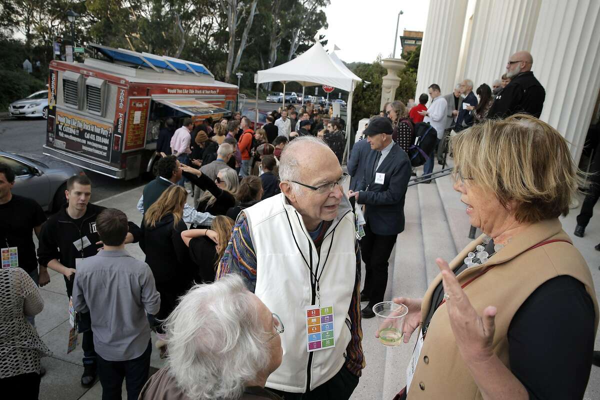 Mary Lou Jepsen, right, chats with Donald Knuth, center, and his wife, Jill Knuth, left, on the steps of the Internet Archive during a 20th anniversary celebration of the Internet Archive in San Francisco, Calif., on Wednesday, October 26, 2016.