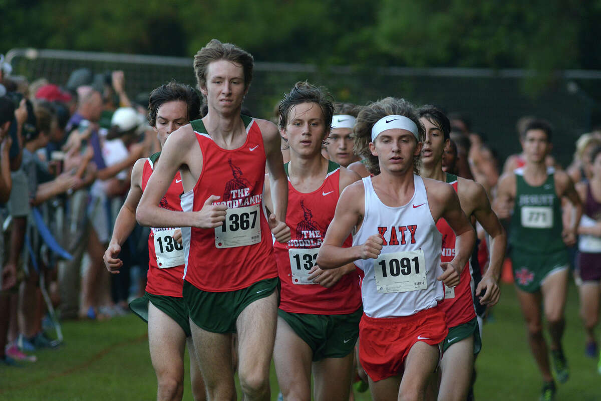 The Woodland's Noah Wells (1367) and Katy's Ryan Yerrow (1091) bookend eventual winner William Hunsdale, center, of The Woodlands, during the Varsity Boys 4800 Meter Run at the Andy Wells Invitational at Kingwood High School on Sept. 17, 2016. (Photo by Jerry Baker/Freelance)