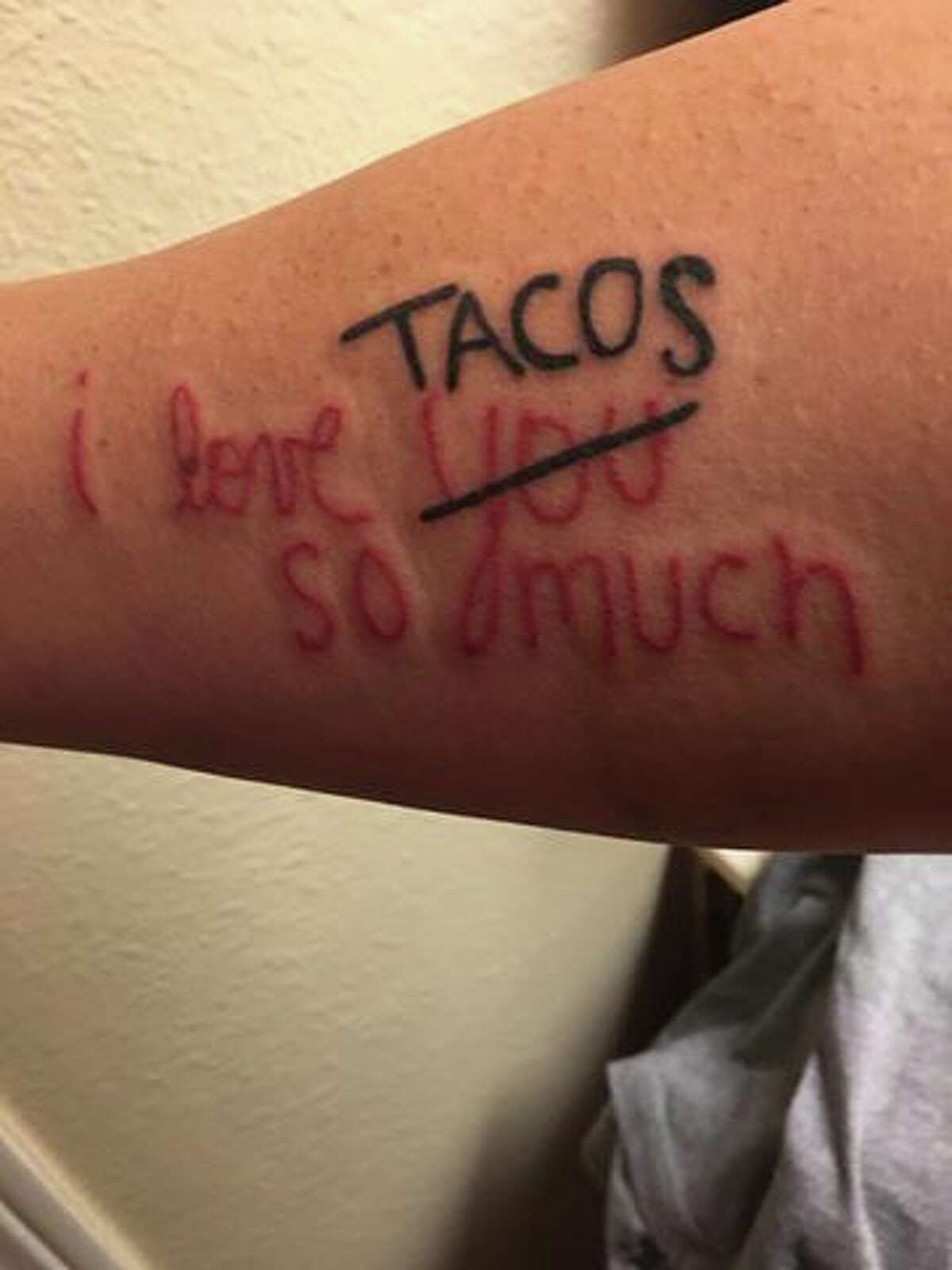 Cesar Aldape, a 46-year-old San Antonio native, got a tattoo on his forearm of the "I love tacos so much" wall. 