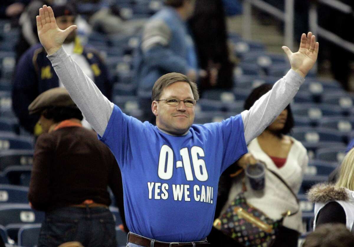 A Detroit Lions fan wears a bag during the fourth quarter of an NFL  football game against the Chicago Bears at Ford Field in Detroit, Sunday,  Dec. 5, 2010. (AP Photo/Carlos Osorio