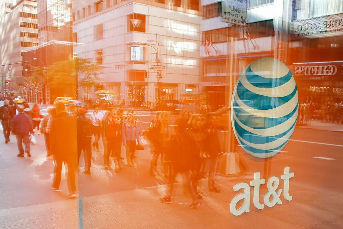 An AT&T store is seen on 5th Avenue in New York on October 23, 2016. AT&T unveiled a mega-deal for Time Warner that would transform the telecom giant into a media-entertainment powerhouse positioned for a sector facing major technology changes. The stock-and-cash deal is valued at $108.7 billion including debt, and gives a value of $84.5 billion to Time Warner -- a major name in the sector that includes the Warner Bros. studios in Hollywood and an array of TV assets such as HBO and CNN. / AFP PHOTO / KENA BETANCURKENA BETANCUR/AFP/Getty Images