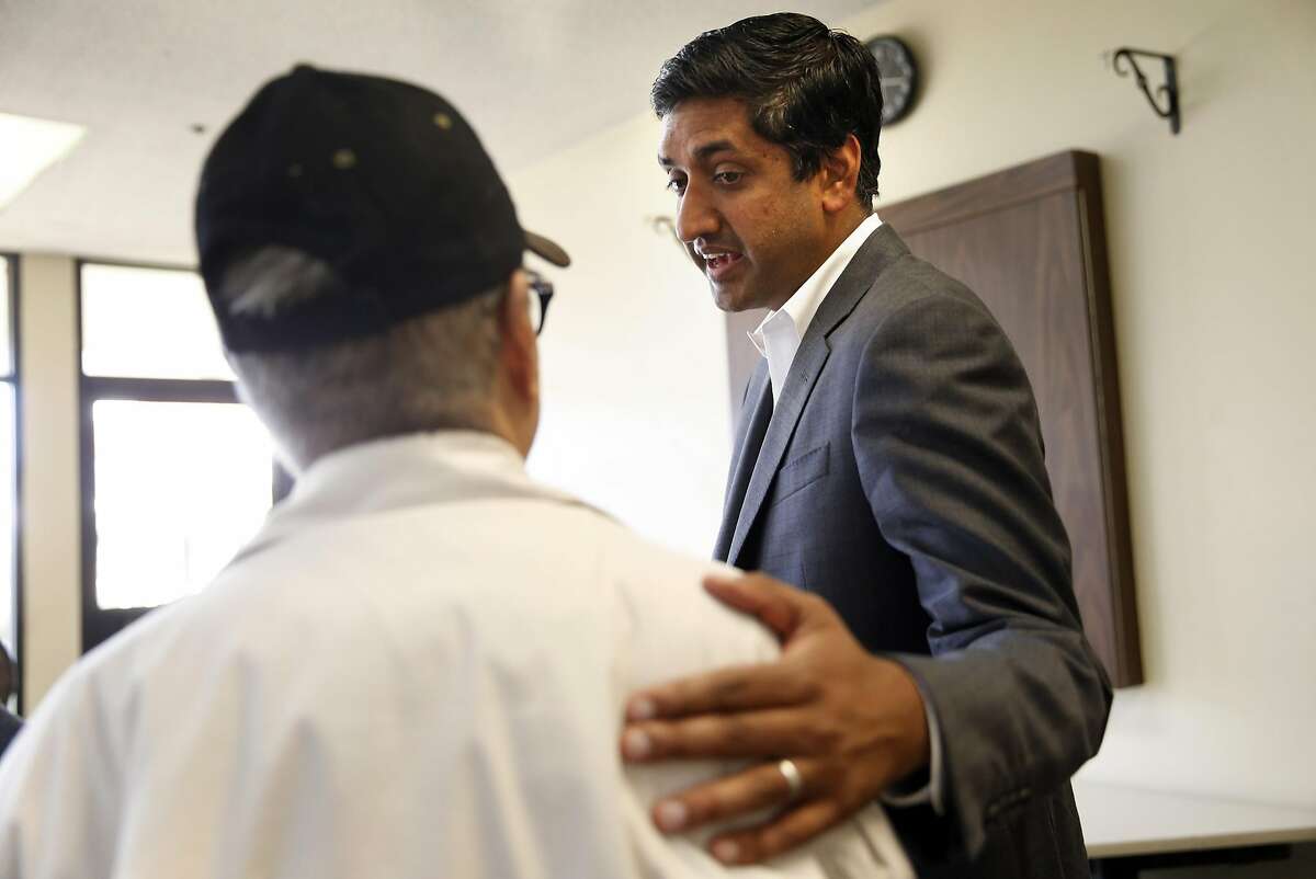 Ro Khanna, Democratic candidate for California's 17th Congressional District, speaks with Milpitas resident. Romeo Castro, before town hall meeting in Milpitas, Calif., on Monday, April 4, 2016.