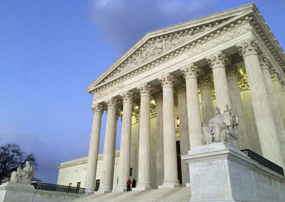 FILE - In this Feb. 13, 2016, file photo, people stand on the steps of the Supreme Court at sunset in Washington. A flurry of documents in a San Francisco court case has disclosed a previously unknown Trump administration policy, in effect since March: a ban on abortions for pregnant girls who entered the United States alone and are in immigration custody. The policy appears to be illegal, U.S. Magistrate Laurel Beeler said Wednesday, because all women in the United States — including prisoners and immigrants, documented or undocumented — have a constitutional right to abortion.