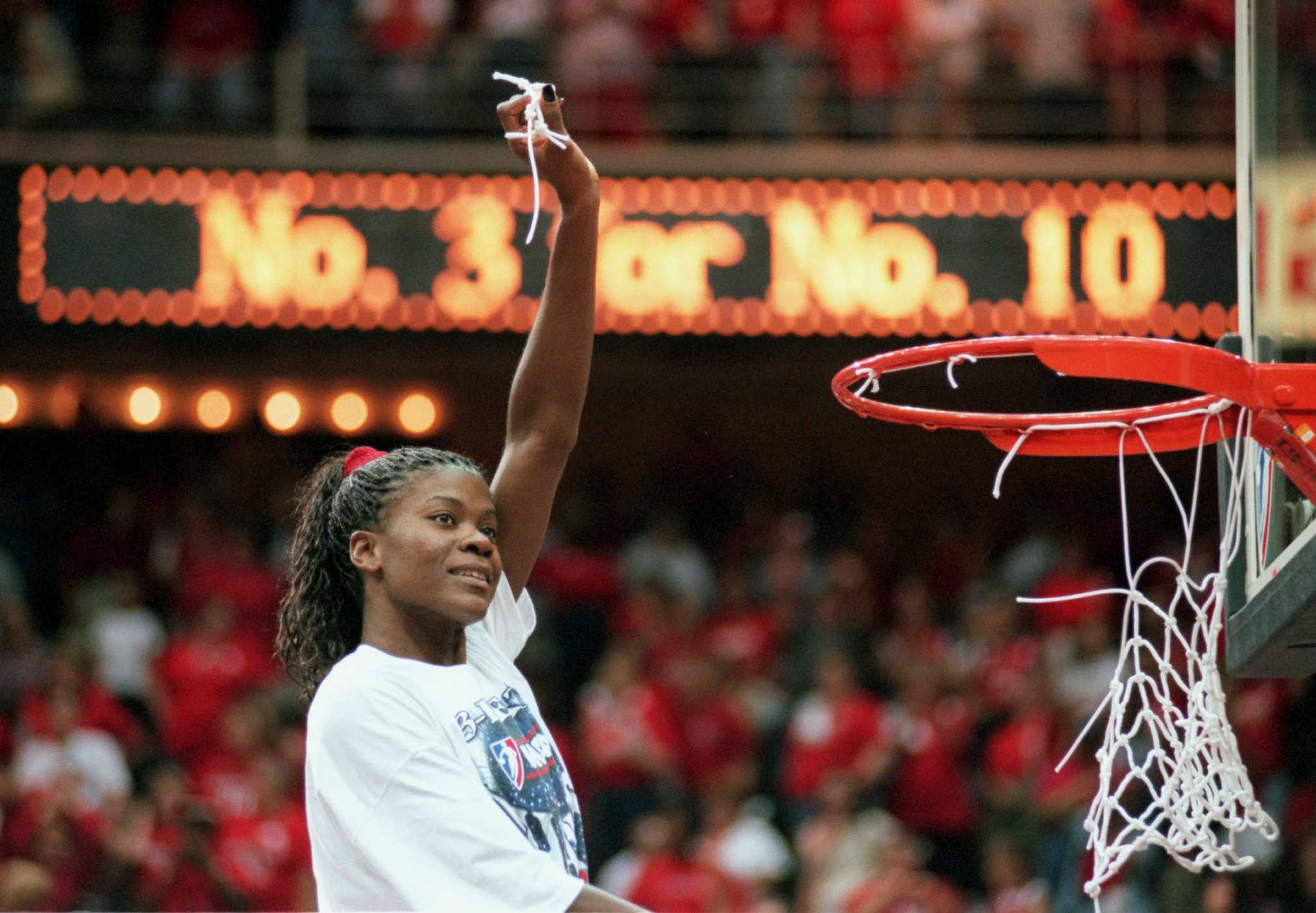 Houston Comets' Sheryl Swoopes, left, cheers on her teammates before the  first half of a WNBA basketball game against the Los Angeles Sparks on  Tuesday, July 25, 2006, in Houston. (AP Photo/Jessica
