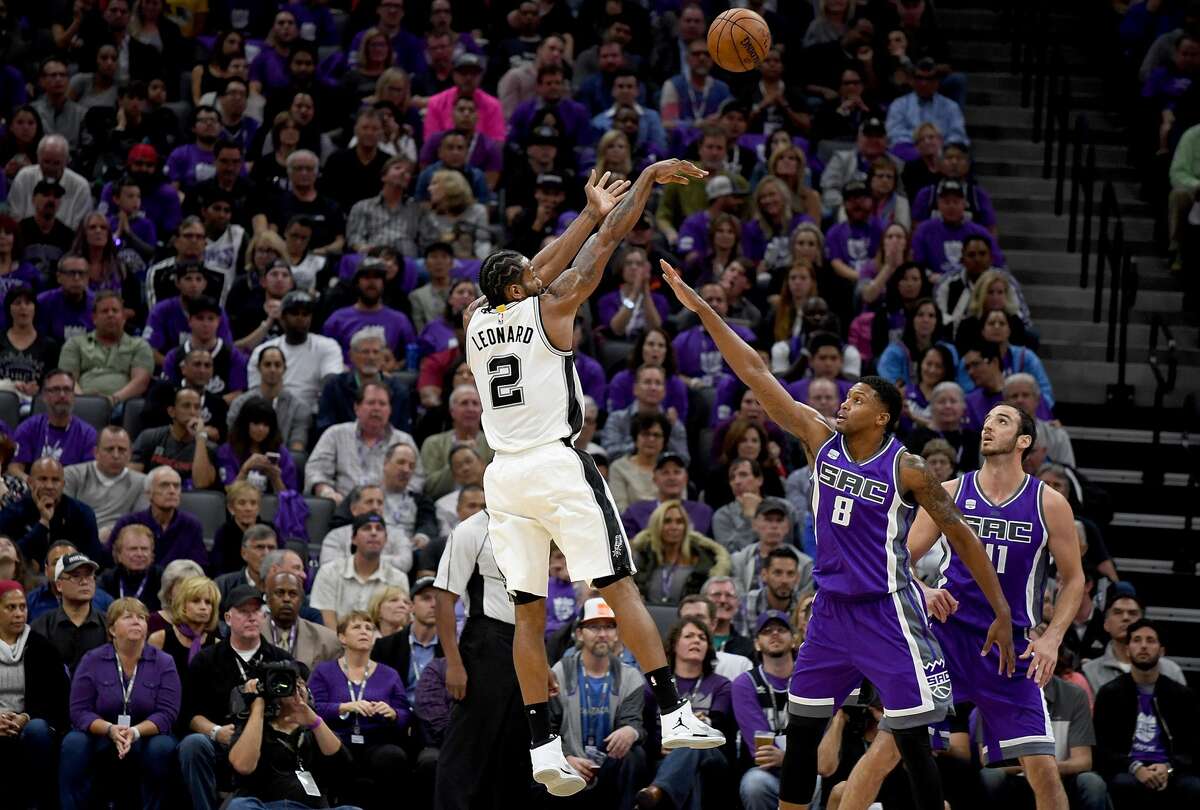 SACRAMENTO, CA - OCTOBER 27: Kawhi Leonard #2 of the San Antonio Spurs shoots over Rudy Gay #8 of the Sacramento Kings during the first quarter of an NBA basketball game at Golden 1 Center on October 27, 2016 in Sacramento, California. NOTE TO USER: User expressly acknowledges and agrees that, by downloading and or using this photograph, User is consenting to the terms and conditions of the Getty Images License Agreement. (Photo by Thearon W. Henderson/Getty Images)