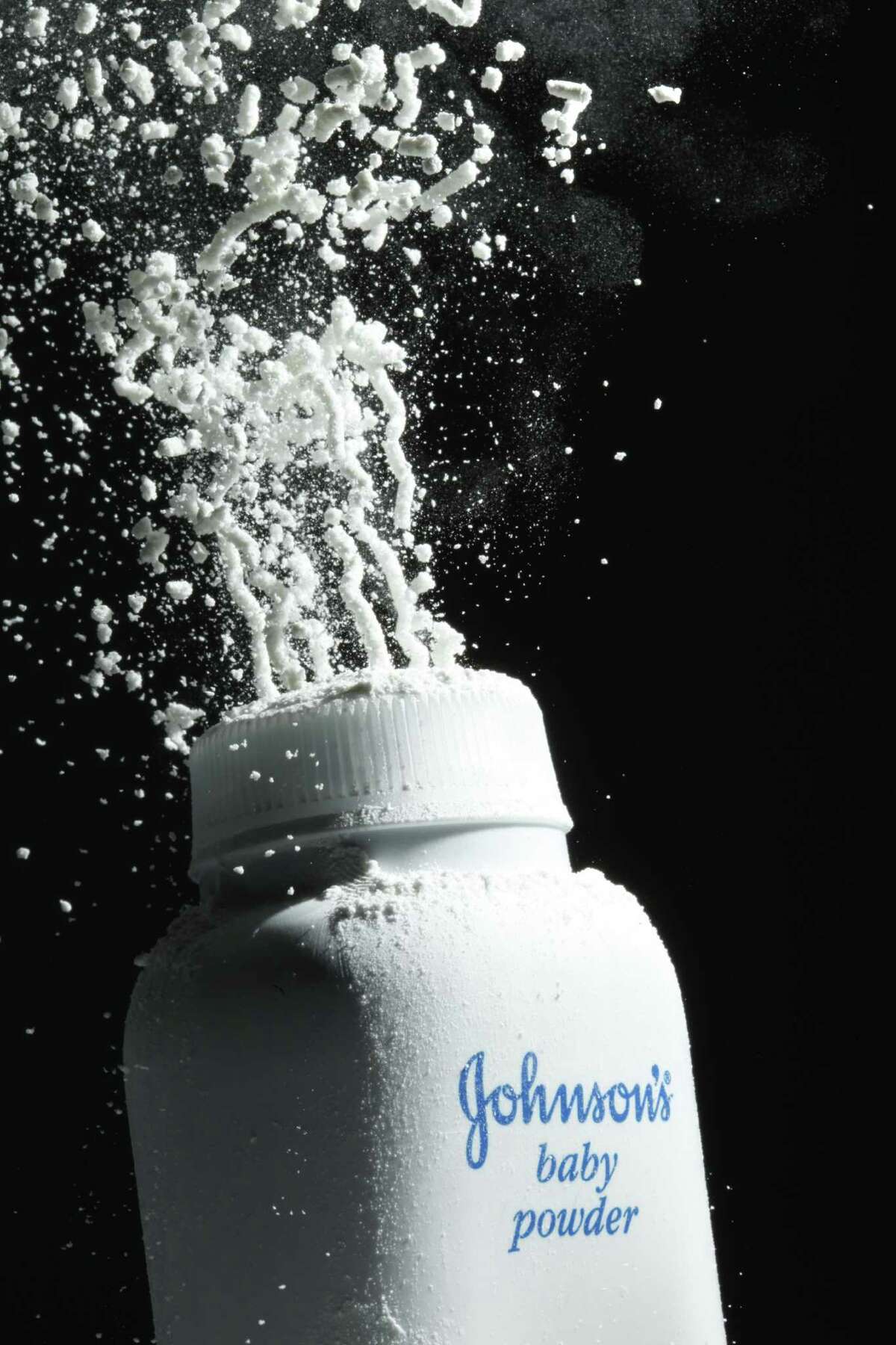 FILE - In this April 19, 2010, file photo, Johnson's baby powder is squeezed from its container in Philadelphia. On Thursday, Oct. 27, 2016, Johnson & Johnson was hit with a multimillion-dollar jury verdict in the massive litigation over whether the talc in its iconic baby powder causes ovarian cancer when applied regularly for feminine hygiene. (AP Photo/Matt Rourke, File)