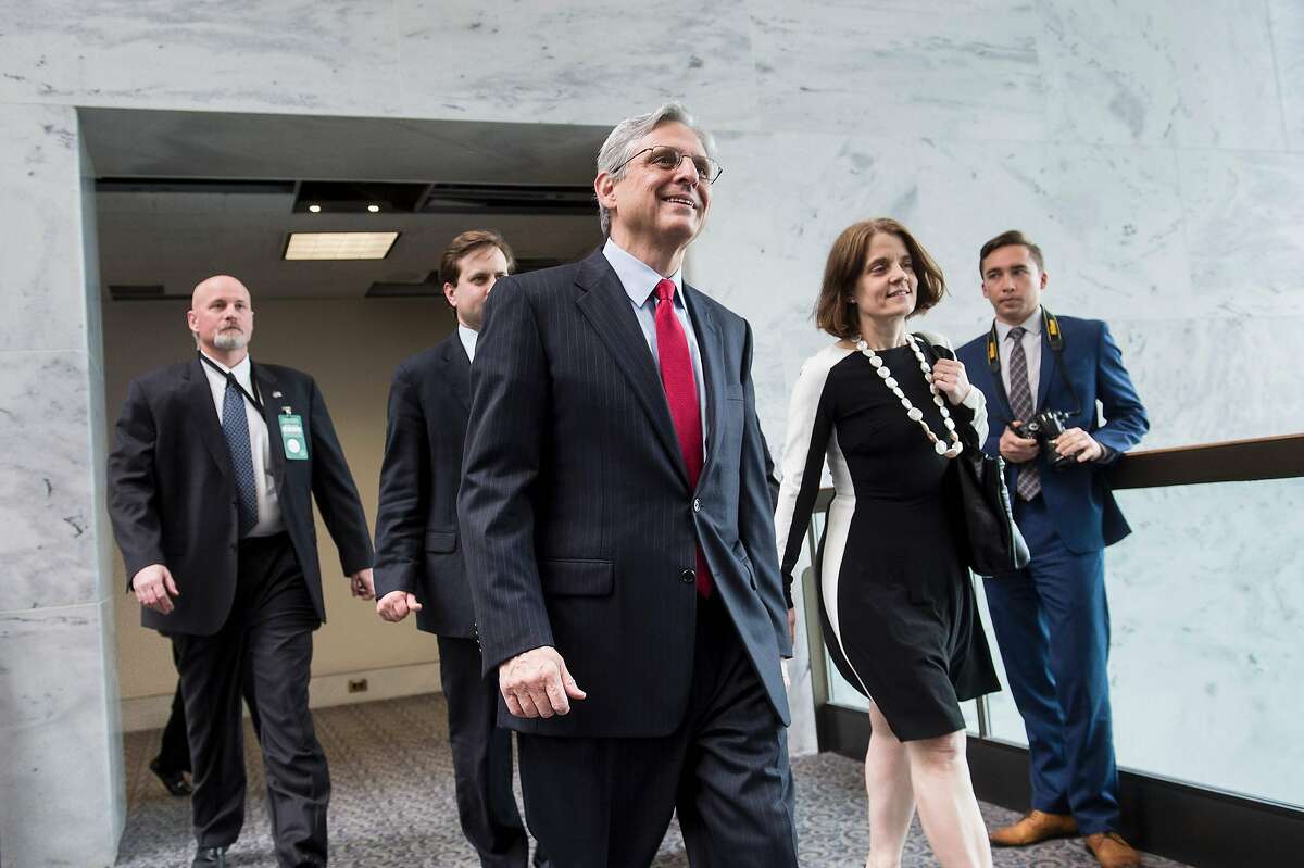 US Supreme Court nominee Judge Merrick Garland walks others to a meeting with Sen. Brian E. Schatz (D-HI) on Capitol Hill May 10, 2016 in Washington, DC. / AFP PHOTO / Brendan SmialowskiBRENDAN SMIALOWSKI/AFP/Getty Images