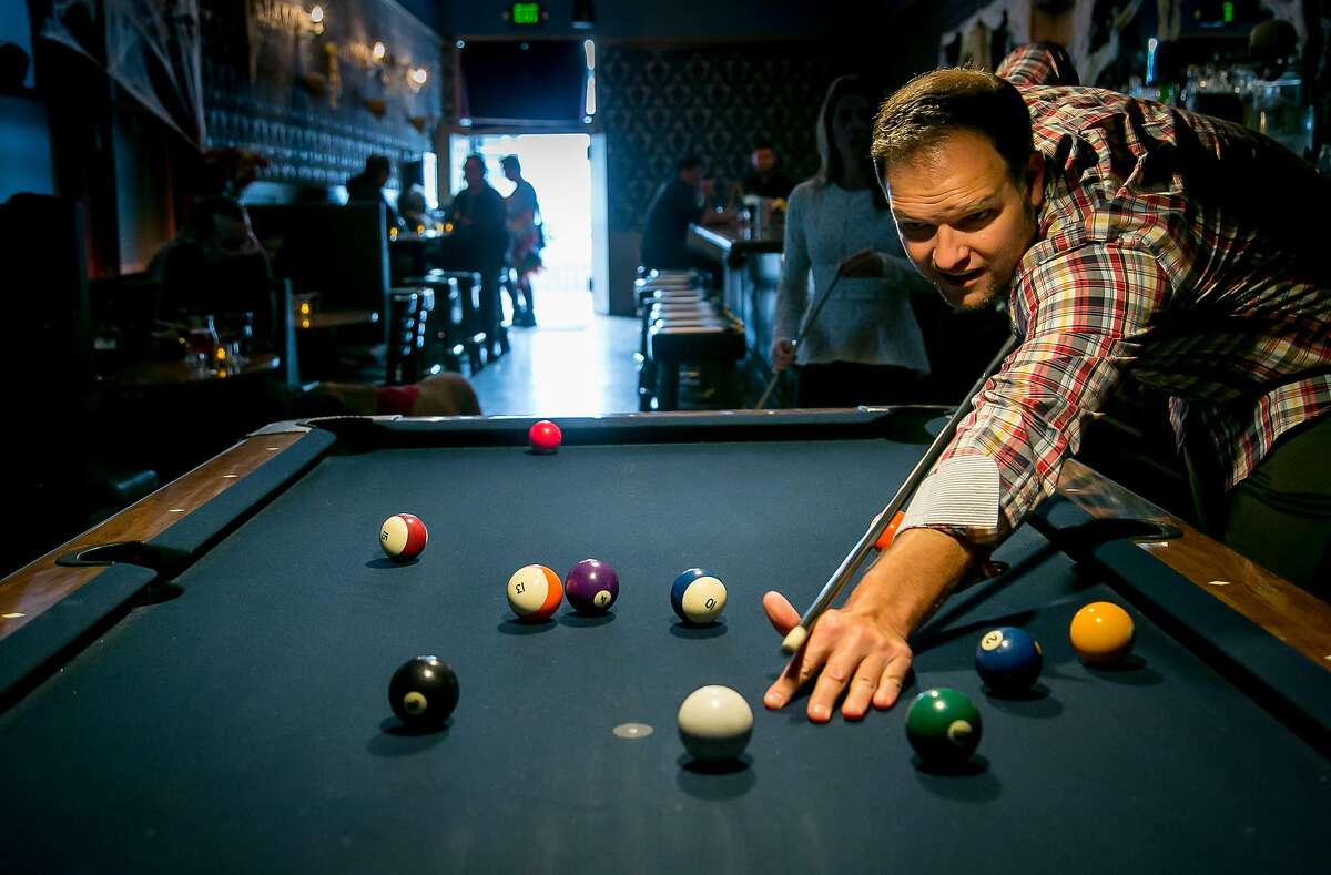 Richard Lutkus shoots pool at the Sea Star bar in San Francisco, Calif. on October 28th, 2016.