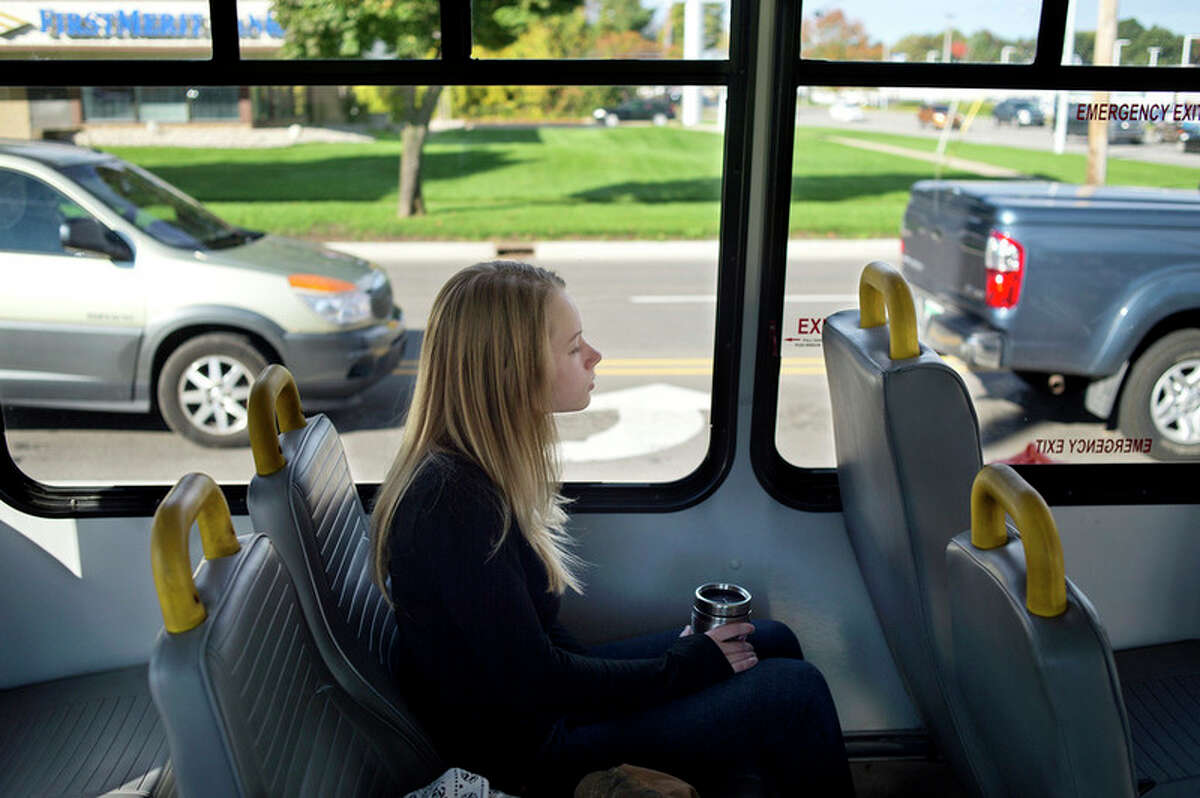 BRITTNEY LOHMILLER | blohmiller@mdn.net County Connection passenger Halie rides the bus to her job at Panera Wednesday morning. This year the County Connection celebrates its' 20th anniversary. On most days there are 33 buses out in the county giving residents rides.