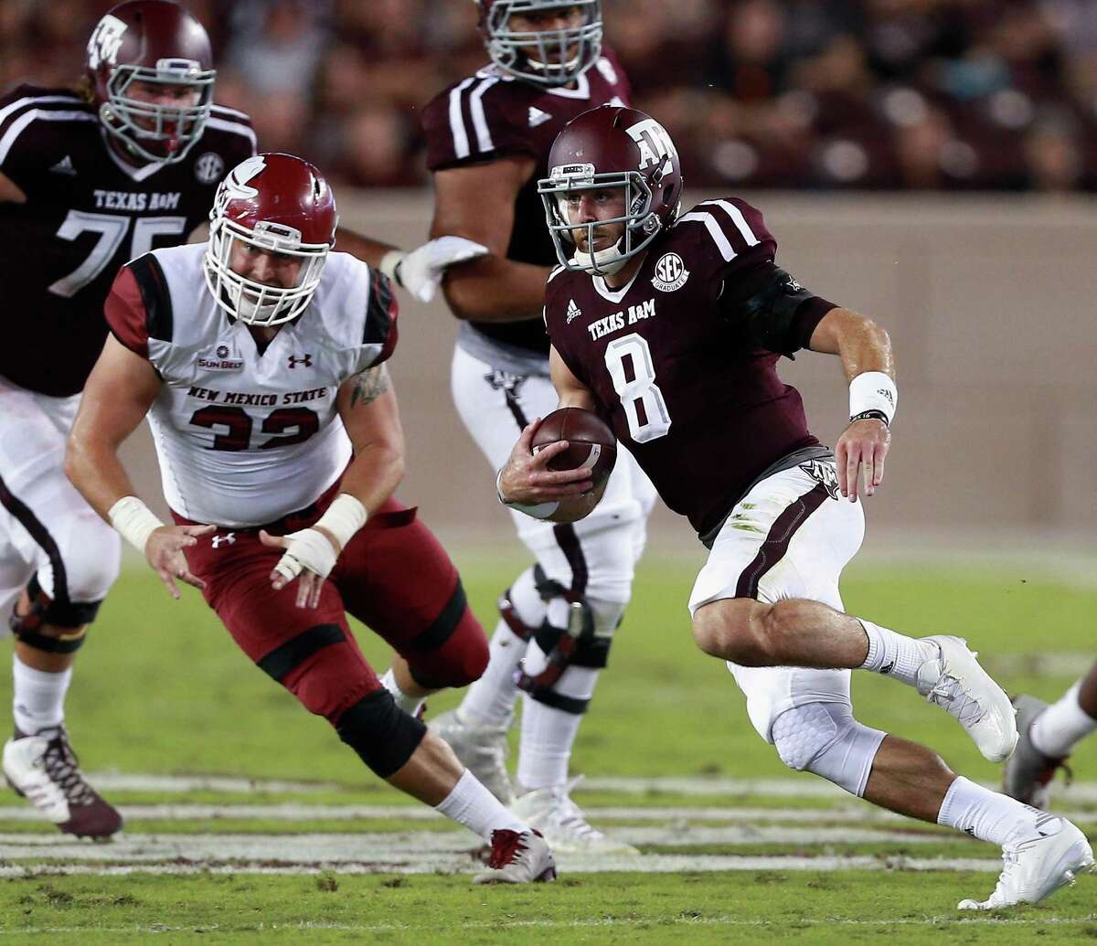 COLLEGE STATION, TX - OCTOBER 29: Trevor Knight #8 of the Texas A&M Aggies scrambles out of the pocket as Dalton Rocha #32 of the New Mexico State Aggies pursues on the play at Kyle Field on October 29, 2016 in College Station, Texas. (Photo by Bob Levey/Getty Images)