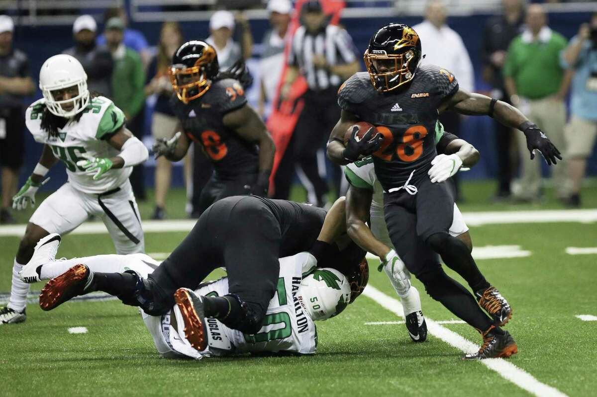 UTSA's Jalen Rhodes runs the ball during the game between the UTSA Roadrunners and the North Texas Mean Green at the Alamodome in San Antonio, Texas on Saturday, October 29, 2016. UTSA defeated North Texas 31-17.