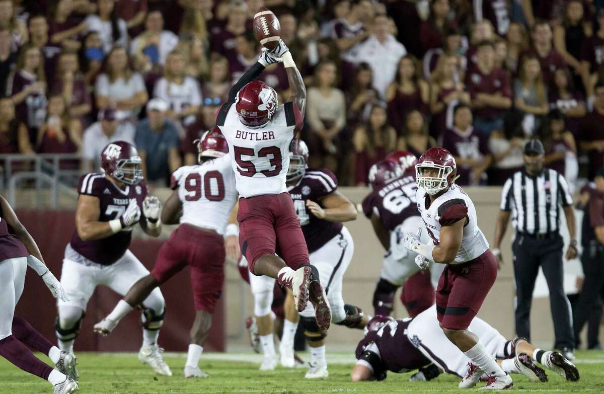 New Mexico State's Rodney Butler (53) bobbles a possible interception against Texas A&M during the first quarter of an NCAA college football game Saturday, Oct. 29, 2016, in College Station, Texas. (AP Photo/Sam Craft)