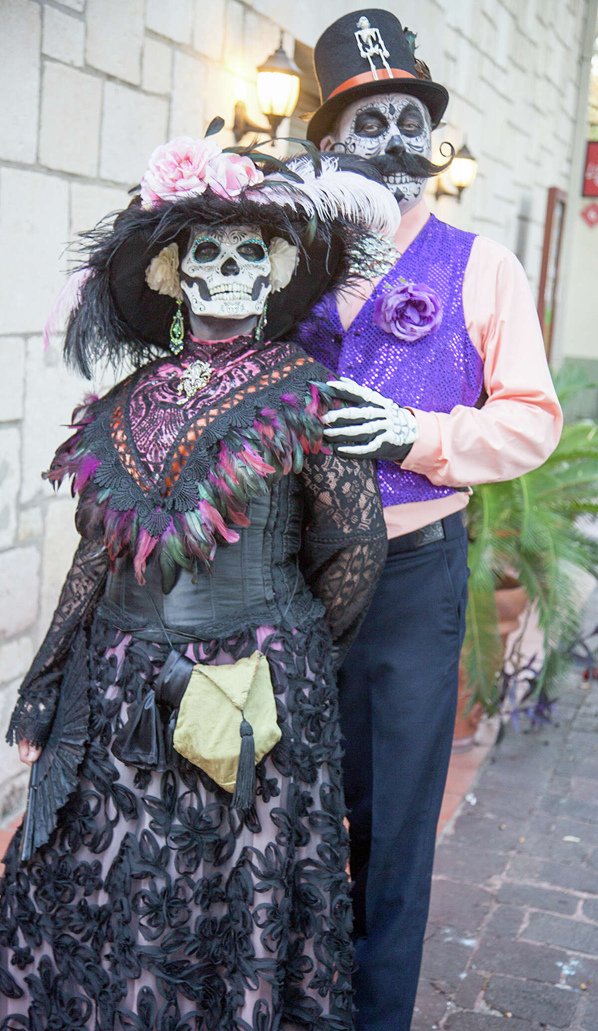 San Antonians celebrated Día de Muertos early this year at La Villita at a free weekend event that included live music, art, dancing, a living altar and a drum and puppet procession.